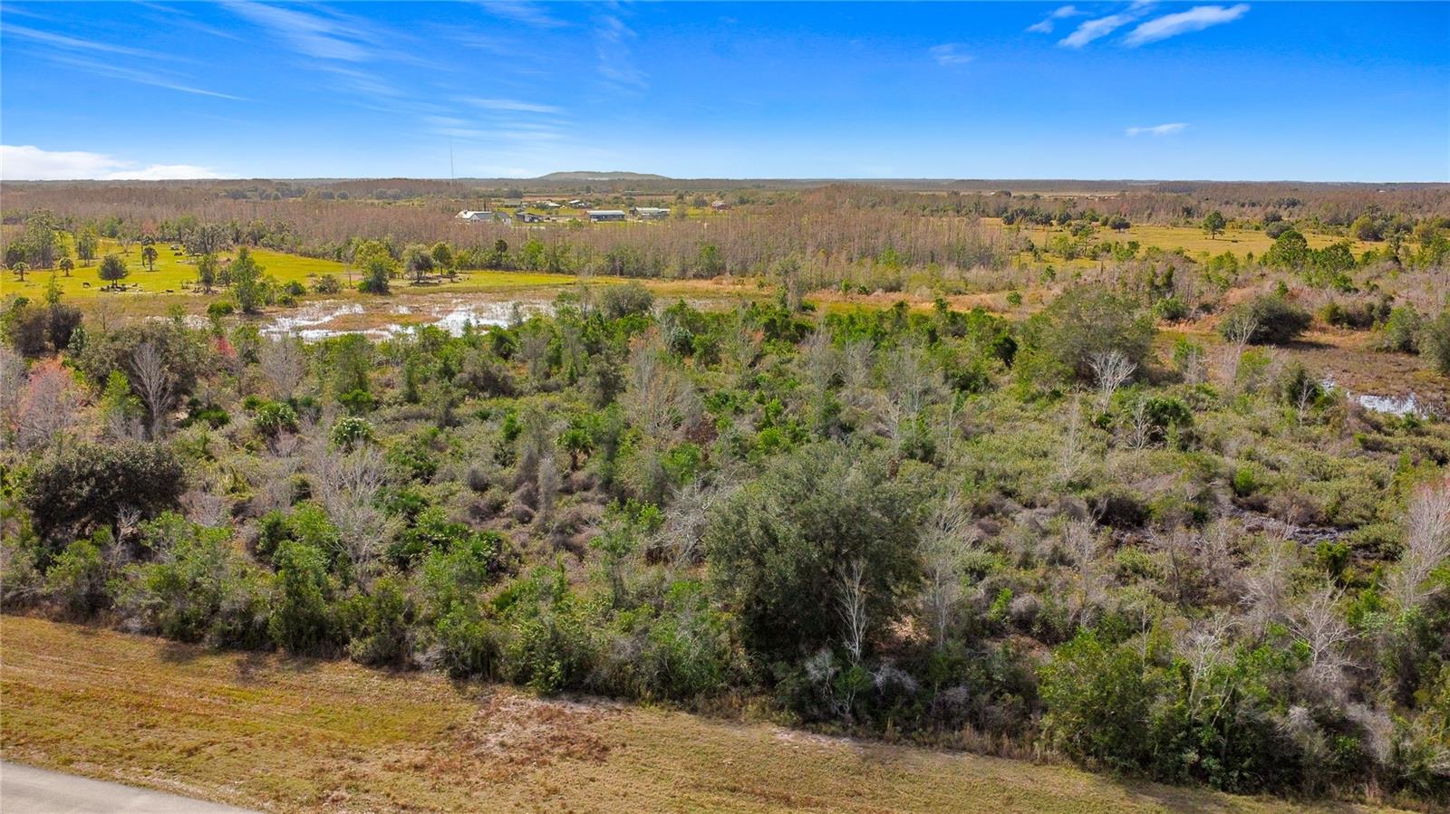 BUILD YOUR DREAM HOME ON 5 ACRES! Discover the perfect opportunity to own 5 spacious acres in St. Cloud, conveniently located near Holopaw, just east of St. Cloud, with paved road frontage. This versatile property offers endless possibilities—place a mobile home or build your custom dream home and enjoy the freedom of wide-open space and peaceful surroundings. This property offers 636 feet of road frontage, zoning is OAC. Bring your goats and chickens, this property is Agricultural Residential. Ideally situated, this property is approximately 30 minutes to Melbourne and just 1 hour to Orlando International Airport, making it easy to enjoy both coastal living and city conveniences. Nearby amenities include a community playground, soccer field, jogging paths, and a scenic pond, perfect for outdoor recreation and relaxation. Whether you’re looking for a private retreat, future homesite, or investment opportunity, this land offers the ideal blend of location, space, and potential. Don’t miss your chance to own acreage in a growing area with room to create the lifestyle you’ve been dreaming of. Lot lines depicted in the photo are estimated. All information is deemed reliable and shall be independently verified.
