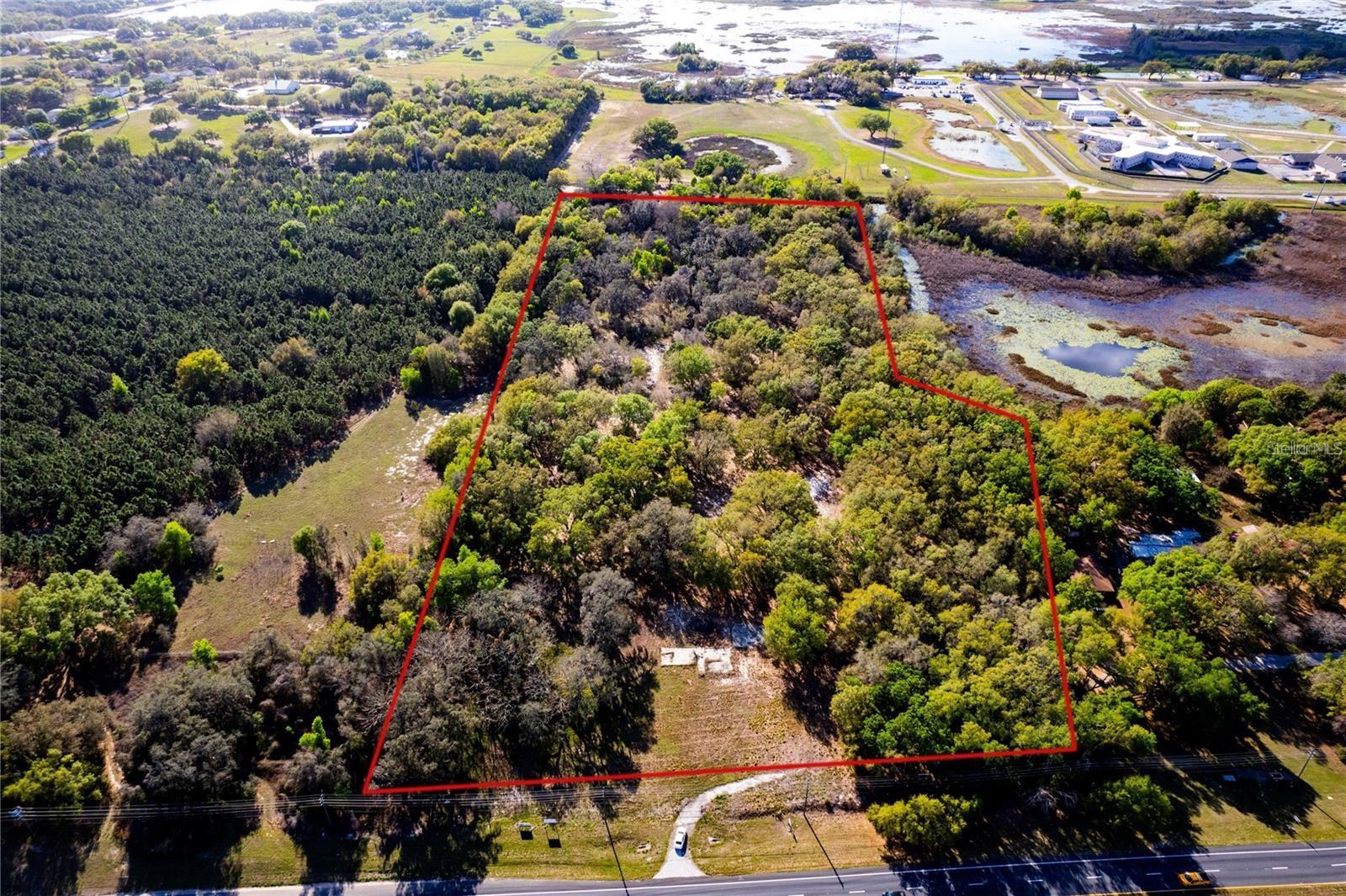 Prime Commercial Land Development Opportunity – 15 Acres in Minneola, FL Now available: a rare opportunity to acquire 15 acres of premier commercial land located at 18537 U.S. Highway 27, Minneola, Florida 34715, offered at $7,499,000. Positioned just minutes from the Florida Turnpike, this high-exposure site offers excellent access, visibility, and long-term growth potential in one of Central Florida’s fastest-growing development corridors. Zoned and fully permitted for a wide range of commercial uses, this property is ideal for developers and investors ready to take advantage of the area’s ongoing expansion. Approved uses include office space, retail services, restaurants, medical clinics, learning centers, and more—catering to the growing needs of the surrounding residential and business communities. Public utilities, including water and sewer, are already available at the site’s perimeter, making the development process more efficient and cost-effective. The full 15-acre parcel is well-suited for a large-scale commercial project, but flexible purchase options are also available to fit different strategies and budgets. Buyers may acquire 5 acres for $2,500,000, 10 acres for $4,900,000, 2 acres for $1,500,000, or 1 acre for $795,000. These smaller parcels are ideal for single-use developments, pad sites, or phased construction plans, while the full 15 acres has a prime footprint for a comprehensive multi-use commercial center. To support buyer flexibility, owner financing may be available, offering attractive terms for qualified purchasers seeking alternatives to traditional financing. Located directly along U.S. Highway 27, the site benefits from excellent daily traffic counts and high visibility. Its proximity to the Florida Turnpike allows for seamless regional access to Clermont, Orlando, and other rapidly growing Central Florida communities, making it a strategic choice for businesses seeking exposure and accessibility. Minneola and the greater Lake County area continue to experience explosive population growth, with thousands of new residential units under development nearby. As demand for commercial services, retail, and professional space continues to rise, this site offers a timely opportunity to meet market needs while securing long-term value. This offering represents more than just a land acquisition—it’s a strategic investment in the future of one of Central Florida’s most desirable commercial corridors. With zoning, entitlements, utilities, multiple parcel options, and owner financing already in place, the groundwork has been laid for immediate success. Contact us today for additional details, financing terms, or to schedule a private site visit.