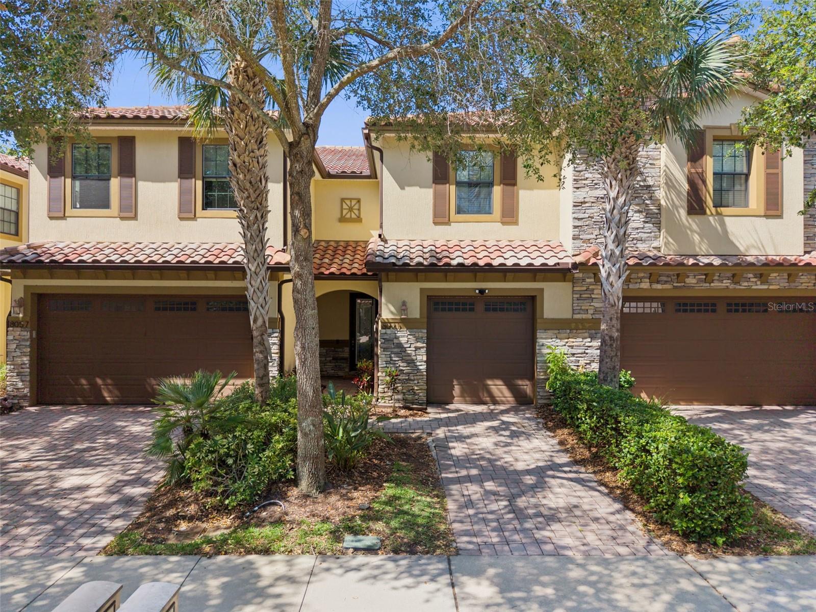 • GATED GOLF COURSE COMMUNITY
• NO CARPET THROUGHOUT THE HOME
• BEAUTIFULLY UPDATED AND MOVE-IN READY
• SCREENED PAVER PATIO WITH NO REAR NEIGHBORS
• PRIME LAKE NONA LOCATION
Welcome home to this beautifully updated 3-bedroom, 2.5-bath townhome with a one-car garage in the highly sought-after Eagle Creek Golf Community in Lake Nona. Surrounded by mature landscaping and located just steps from the community pool, this move-in-ready home offers stylish upgrades, spacious living areas, and access to world-class amenities.
As you enter, you'll immediately notice the soaring ceilings, elegant crown molding, and updated flooring throughout. The welcoming entryway features a convenient drop zone and opens to a spacious floor plan designed for both everyday living and entertaining. The updated kitchen showcases freshly painted white wood cabinetry (2020), granite countertops, updated backsplash, stainless steel appliances, and overlooks the dining area and large family room.
Sliding glass doors lead to an oversized screened lanai featuring brick pavers and a tall screen enclosure that creates an open, airy feel while allowing you to enjoy Florida living year-round. This inviting outdoor space is perfect for relaxing, entertaining, or enjoying your morning coffee while overlooking a large green space with no rear neighbors.
The first floor also features a beautifully updated half bath (2025) complete with stylish tile flooring, beadboard accents, updated vanity, and modern lighting.
Upstairs, you'll find gorgeous wood flooring throughout the loft and bedrooms (2024), along with a staircase featuring a designer carpet runner. The versatile loft provides the perfect flex space for a home office, reading nook, playroom, or additional living area. The spacious primary suite offers a tray ceiling, large walk-in closet, and an updated ensuite bath featuring dual granite vanities, updated mirrors, faucets, lighting, and a walk-in shower. Two additional bedrooms and a full bathroom with granite countertops and updated fixtures complete the second floor.
Recent improvements include painted kitchen cabinets (2020), interior paint (2024), wood flooring in loft and bedrooms (2024), luxury vinyl plank flooring (2025), half bath renovation (2025), washer and dryer (2024), and dishwasher (2025).
Exterior highlights include a tile roof, elegant stone-accented façade, brick-paver driveway, mature landscaping, and a private backyard setting with no rear neighbors. The spacious paver patio and tall screened enclosure provide the perfect blend of indoor-outdoor living.
Residents enjoy access to Eagle Creek's exceptional resort-style amenities, including a 24-hour guarded gate, championship golf course, clubhouse with restaurant and bar, state-of-the-art fitness center, resort-style pools, splash pad, hot tub, tennis courts, pickleball courts, basketball courts, playgrounds, and walking trails.
Perfectly located across from Lake Nona Medical City and minutes from SR 417, SR 528, Orlando International Airport, Downtown Orlando, shopping, dining, and entertainment. Don't miss your opportunity to own this exceptional townhome in one of Lake Nona's most desirable communities. Schedule your private showing today!