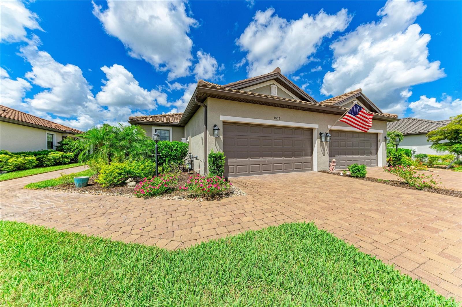 Imagine waking up each day to the elegance of resort-style living in the exclusive Esplanade at Azario, one of Lakewood Ranch's most coveted luxury communities. Blending sophistication, comfort, and an unparalleled lifestyle, this impeccably appointed villa offers a rare opportunity to enjoy refined, maintenance-free living surrounded by breathtaking surroundings.  From its designer-curated finishes and timeless neutral palette to its extensive collection of premium upgrades, every detail has been thoughtfully crafted to elevate everyday living.  Featuring 2 bedrooms, 2 bathrooms, and a versatile den, this thoughtfully designed home offers elegant tile flooring throughout the main living areas and an open-concept floor plan ideal for everyday living and entertaining.  The stunning chef's kitchen is enhanced with upgraded appliances, a custom designer backsplash, premium cabinetry with convenient pull-out drawers, an oversized refrigerator, designer lighting and exquisite custom moldings.  The spacious primary suite features custom-finished closets and a luxurious bath with upgraded tile and upgraded finishes.  The guest bath is equally impressive with custom tile work and quality appointments.  A fully finished laundry room includes additional cabinetry for storage and organization.  Step outside to the extended screened lanai and enjoy peaceful views of the private backyard, creating the perfect setting for morning coffee, outdoor dining, or simply relaxing in your own tranquil retreat.  Residents of Esplanade at Azario enjoy an unparalleled lifestyle with world-class amenities, including resort-style pools, a full service spa and salon, fitness center, tennis and pickleball courts, walking trails, playground, Bahama Bar, Barrel House Bistro, Culinary Center, Oak and Stone Pizzeria, coffee shop, and an 18-hole championship golf course.  Experience the ultimate Florida lifestyle in the heart of Lakewood Ranch, where luxury, recreation, and convenience come together beautifully.
