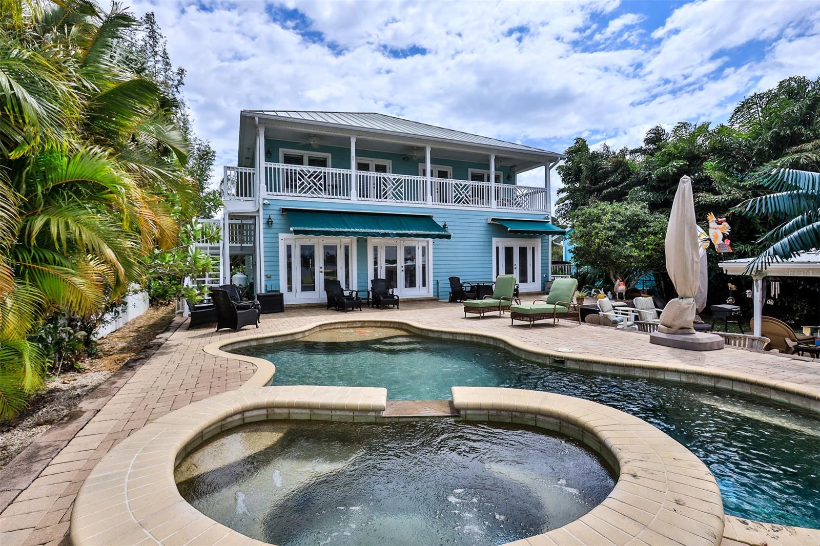 Absolutely Stunning Custome Built Home On Turnbull Bay! Hardwood & 18 Inch Tile Throughout. 8' Doors, All Granite. Two Master Suites With Water View Balcony. Vaulted Ceilings. Huge Walk-in Closets. Fabulous Waterfront Pool & Spa With Cabana Fully Equipped Cabana Bar. Boat Dock, BoatHouse with Lift. Walk-in Closets. Coffee Room In Master Bedroom. Laundry Rooms Upstairs and Downstairs. Zoned AC Units. Hand Etched Custom Doors. Custom Construction Concrete Block with Spray Foam Insulation, Hardy Board, Walkin Floored Attic ;Water: City