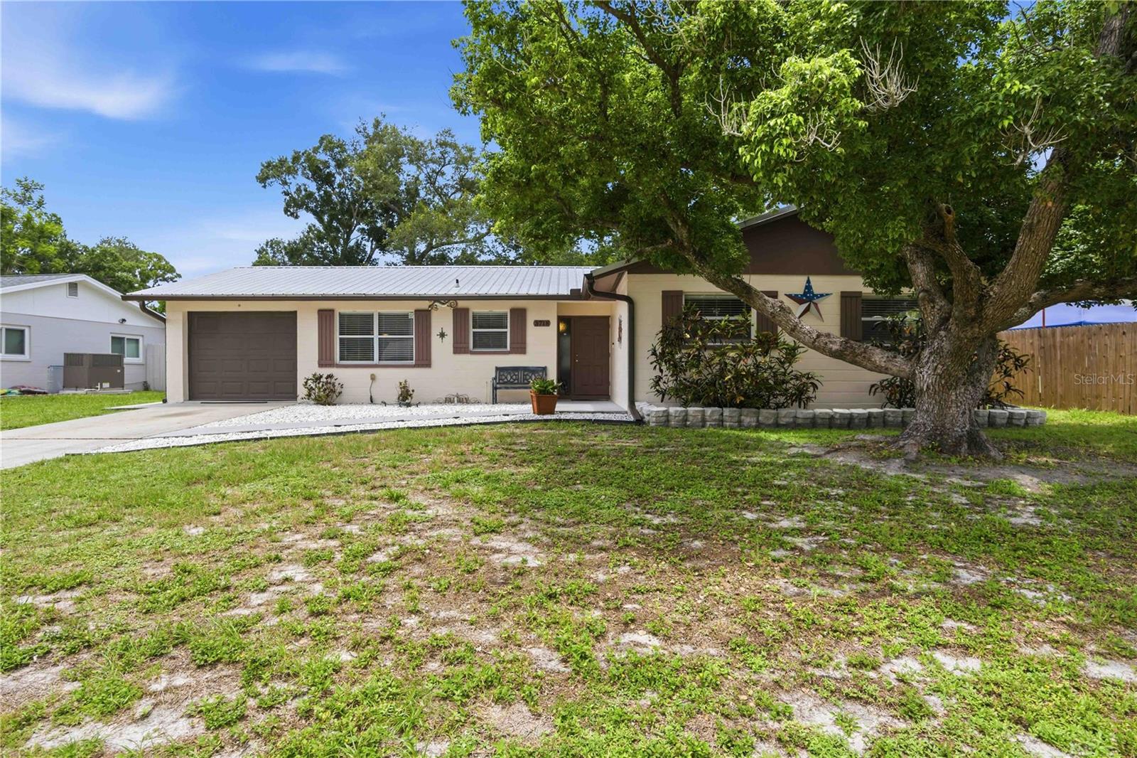 Welcome to 3718 Woodmont Drive! A meticulously maintained 3-bedroom, 2-bathroom home in a convenient central Sarasota location with NO HOA. This move-in ready home features a durable metal roof, brand-new stainless steel appliances (2025), a new water heater (2025), PVC drain lines, a hurricane-impact garage door (2020), and new Hardie® board siding with additional waterproof barrier for added durability and peace of mind. The open floor plan offers comfortable living spaces, while the screened-in patio overlooks a large, fully fenced backyard that's perfect for entertaining, pets, or play. Ideally located with quick access to I-75 and just minutes from Downtown Sarasota, shopping, dining, and world-famous Siesta Key Beach. Don't miss this wonderful opportunity to own this beautifully updated home in the heart of Sarasota!