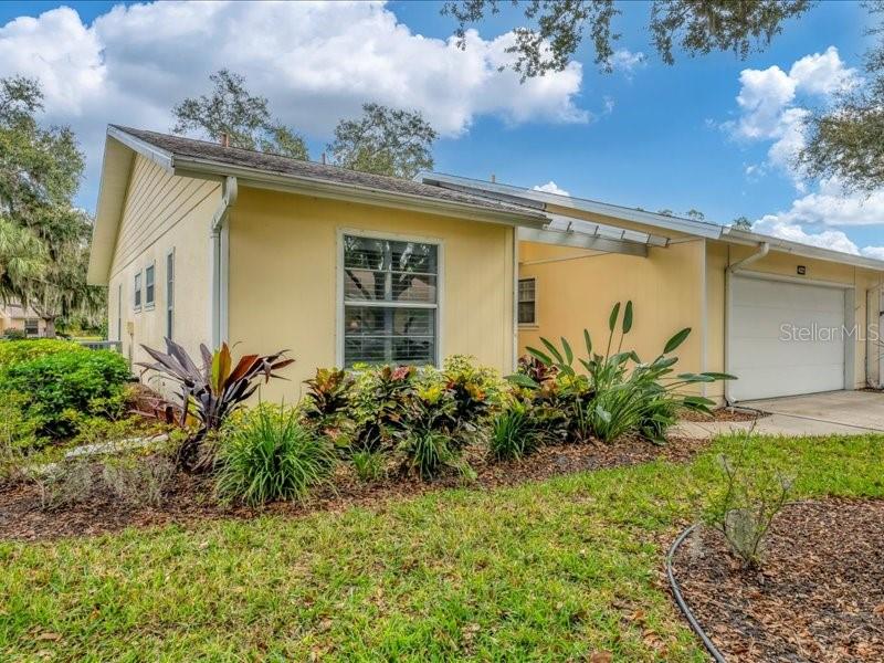 2BR/2BA villa in a maintained 55+ community with a brand-new roof (Dec 2025), updated interior finishes, and a quiet setting with mature trees and wide green space behind the home. This single-story residence offers an efficient layout with an enclosed all-season lanai featuring sliding glass windows that open or close as needed for year-round use. Updated flooring and modernized baths add comfort and function throughout the home. The floor plan includes a spacious living area, dining space in the kitchen, and two well-sized bedrooms A two-car garage provides secure parking and additional storage options.

Exterior maintenance and landscape care are included through the association for easy living. Community amenities include a pool and clubhouse located within the neighborhood. The property benefits from the peaceful interior location of the community while still offering quick access to everyday conveniences and Sarasota destinations. Nearby shopping and daily essentials include Publix Beneva Village (1.1 mi) and Detwiler’s Farm Market (1.2 mi). Urfer Family Park is 1.6 miles away and offers nature trails, boardwalks, greenspace, and activity areas. Sarasota Memorial Hospital is 4.1 miles away, and downtown Sarasota is 5.6 miles away with restaurants, arts venues, waterfront parks, and retail. Siesta Key Beach is approximately 6.3 miles away for Gulf access and beach recreation.

The villa’s location within the community provides reduced through-traffic and a calmer setting. The floor plan included in the listing photos shows the functional room flow and layout. A Zillow 3D Home tour is also available for an immersive view of the property. This well-maintained villa blends updated interior elements, practical features, and a low-maintenance lifestyle in a convenient Sarasota location close to shopping, parks, healthcare services, and area beaches. All information is deemed reliable but should be verified by the buyer.