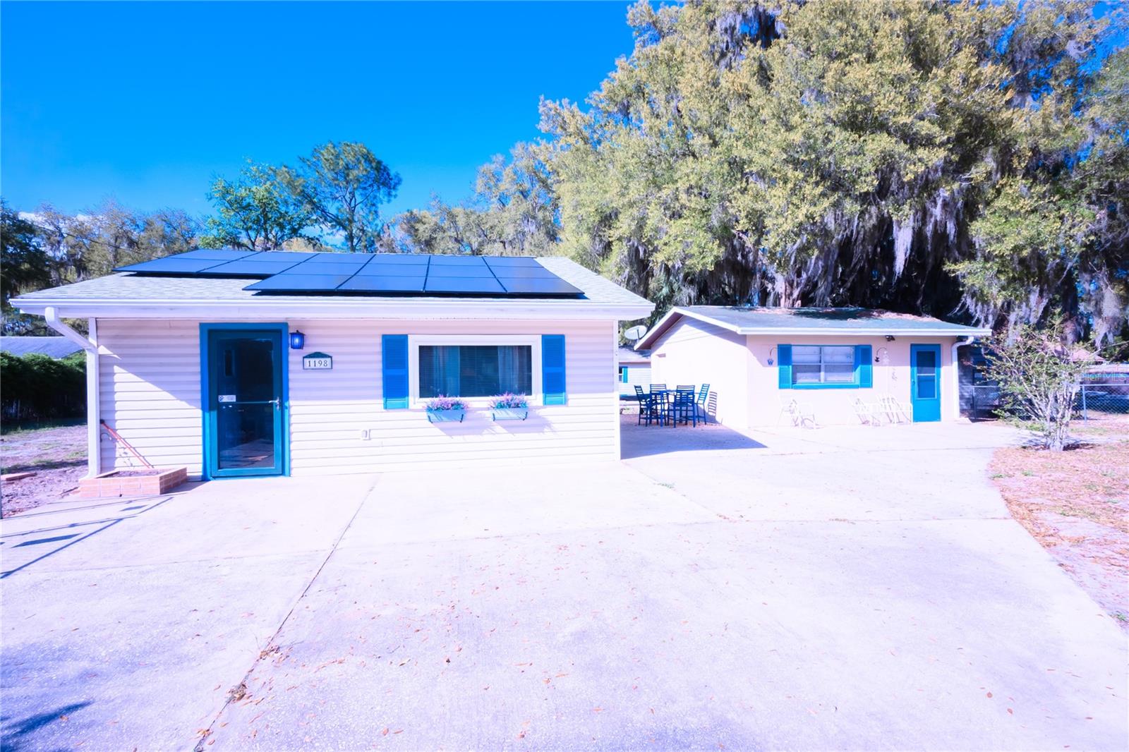 Private Florida Retreat on Nearly Half an Acre – Solar Powered with Bonus Flex Space!
Looking for space, privacy, and flexibility? This unique Lake Panasoffkee property sits on a fully fenced .47 acre lot and offers a rare combination of efficiency, functionality, and outdoor freedom with no HOA restrictions.
The main home features a comfortable 1 bedroom, 1 bathroom layout with great natural light and a cozy feel, perfect for a primary residence, winter getaway, or rental opportunity. Recently installed solar panels help keep electric costs low and add long-term value.
The property also includes a detached garage with finished interior space currently set up as additional living/flex space (not included in living square footage). This creates excellent potential for guests, a home office, workshop, or hobby area depending on your needs. A separate storage shed adds even more utility.
Outside you'll find plenty of room to: ? Park boats, RVs, or trailers
? Add a garden or outdoor entertainment area
? Store work equipment
? Expand in the future
Located just minutes from Lake Panasoffkee’s famous fishing and boating, with quick access to I-75 for easy commuting to The Villages, Ocala, or Tampa.
Opportunities like this with land, flexibility, and solar efficiency don't come around often at this price point.
Property Features: • .47 acre fenced lot
• Solar power system
• Detached garage with finished flex space (unpermitted conversion)
• Storage shed
• No HOA
• Boat/RV parking
• Quiet country setting
Perfect for first-time buyers, investors, snowbirds, or anyone wanting space without restrictions.