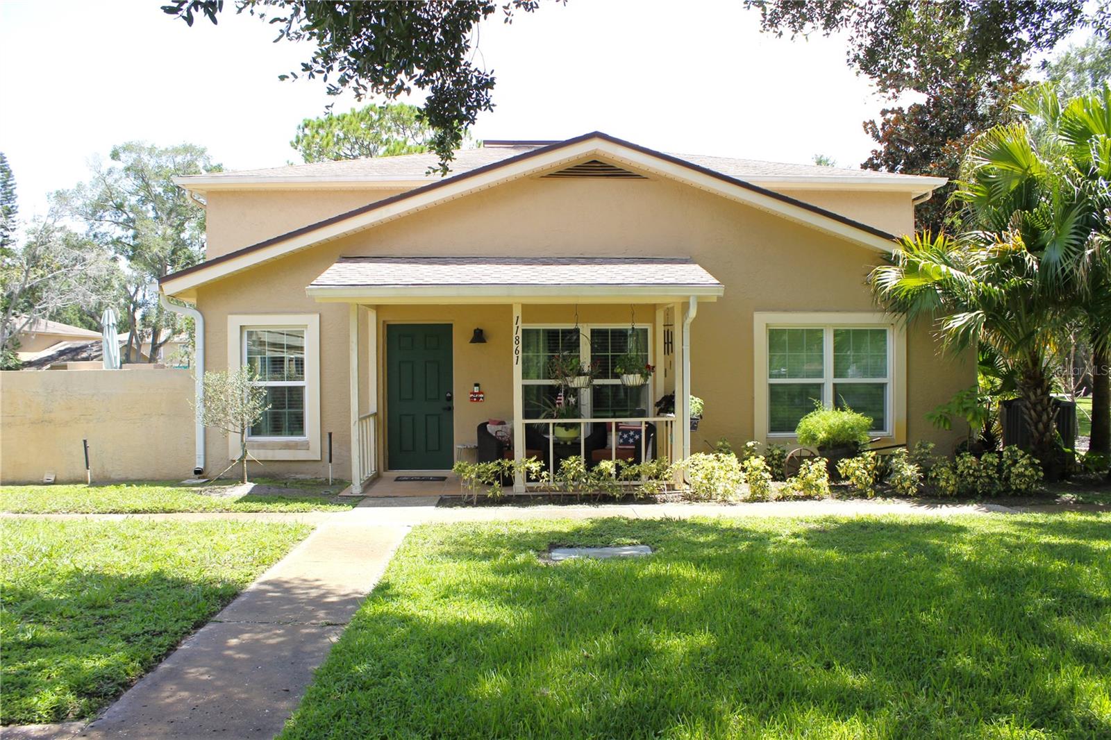 Experience comfort, style, and convenience in this beautifully updated end-unit condo. Ideally located just 5 minutes from USF, Moffitt Cancer Center, VA hospitals, and a short drive to I-275 and I-75, this home offers an inviting atmosphere with mature landscaping and peaceful pond view. All windows and doors are equipped with impact-resistant hurricane glass, eliminating the need for shutters.

The main level features a comfortable flow between the living and dining areas, with sliding glass doors that bring in natural light and provide access to the outdoors. The galley kitchen includes a panoramic window, new stainless-steel energy-efficient appliances, custom cabinetry with ample storage, and elegant quartz countertops.

Also on the main level, a bedroom offers a quiet retreat with a walk-in closet and a full bathroom featuring a walk-in shower. Upstairs, a spacious suite includes a walk-in closet, a full bathroom with a double-sink vanity, custom lighting, and mirrors, along with an additional storage closet.

The HOA covers a wide range of services, reducing maintenance responsibilities and allowing for easy living while enjoying the community amenities.