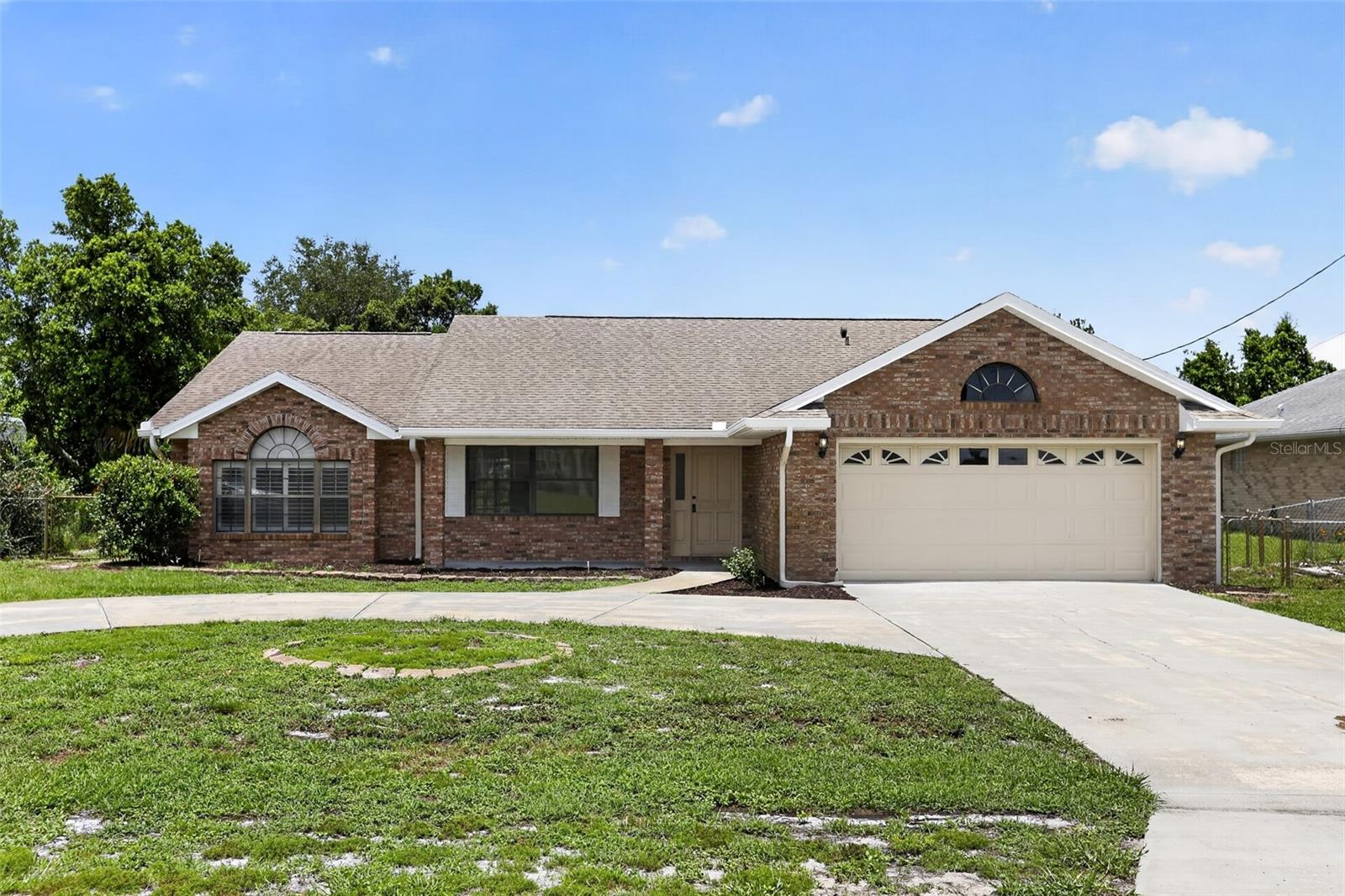 This 3-bedroom, 2-bathroom home offers a bright, spacious layout with abundant natural light and neutral finishes throughout. The kitchen features white painted cabinetry, and ample storage. Enjoy the screened-in lanai overlooking the backyard, perfect for relaxing or entertaining. Complete with a two-car garage and charming brick exterior, this home offers comfort, functionality, and endless potential.