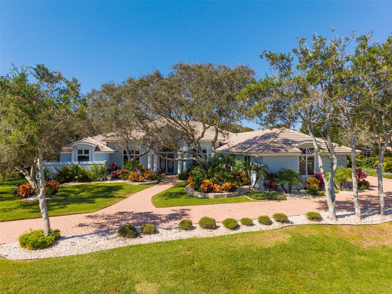 This extraordinary coastal residence is located in the exclusive oceanfront golf community of Hammock Dunes.  Experience refined coastal living with designer finishes and soaring ceilings throughout. This renovated 4 bedroom, 4.5 bath home with 4652sft was built and recently remodeled by Luxury Builders.  Over $800K in recent upgrades offering timeless craftmanship, modern luxury and sophisticated design in every space.  Situated on an oversized cul-de-sac lot with a private drive featuring spectacular golf course and lake views. For peace of mind, there is a new roof, the copper piping has been replaced, upgraded electrical, exterior repainted, new landscaping lighting, new pool pump and filter, new water softener and so much more.  An opportunity awaits to start living the Hammock Dunes lifestyle! To further elevate the Hammock Dunes Community Lifestyle, membership to the Hammock Dunes Club is available offering a superior member experience. Featuring an oceanfront clubhouse as well as a "Low Country" clubhouse with formal and casual dining options, 2 Audobon-certified golf courses by legendary designers Tom Fazio and Rees Jones, a 5000 sqft ocean view fitness center, Oceanfront pool complex, playground, splash pad, tennis courts, pickle ball, croquet, bocce and more.