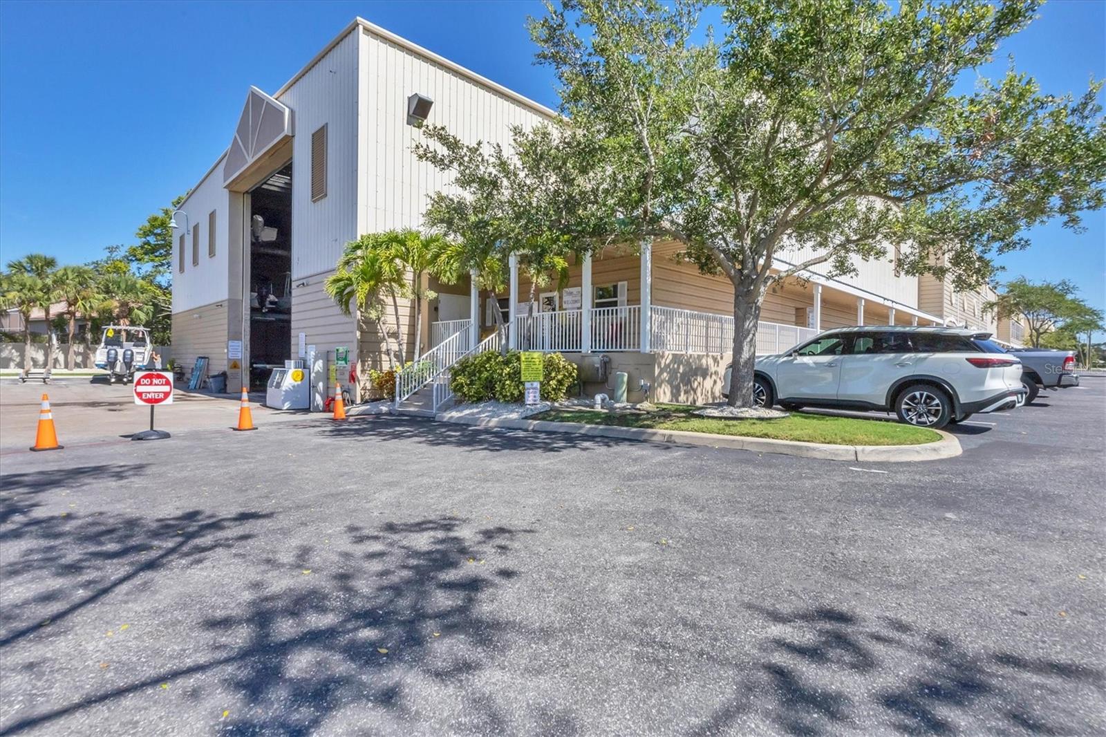 Experience the vibrant waterfront lifestyle at Phillippi Harbor Club in Sarasota. On scenic Phillippi Creek, this premier boat rack facility offers more than just storage — it is a community for boating enthusiasts. This rare, bottom rack slip, conveniently adjacent to the lift tower, provides quick access to open water. Enjoy approximately a four-minute route to the Intracoastal Waterway and just 20 minutes to the Gulf of Mexico. An ideal location for those who value convenience and community on the water.