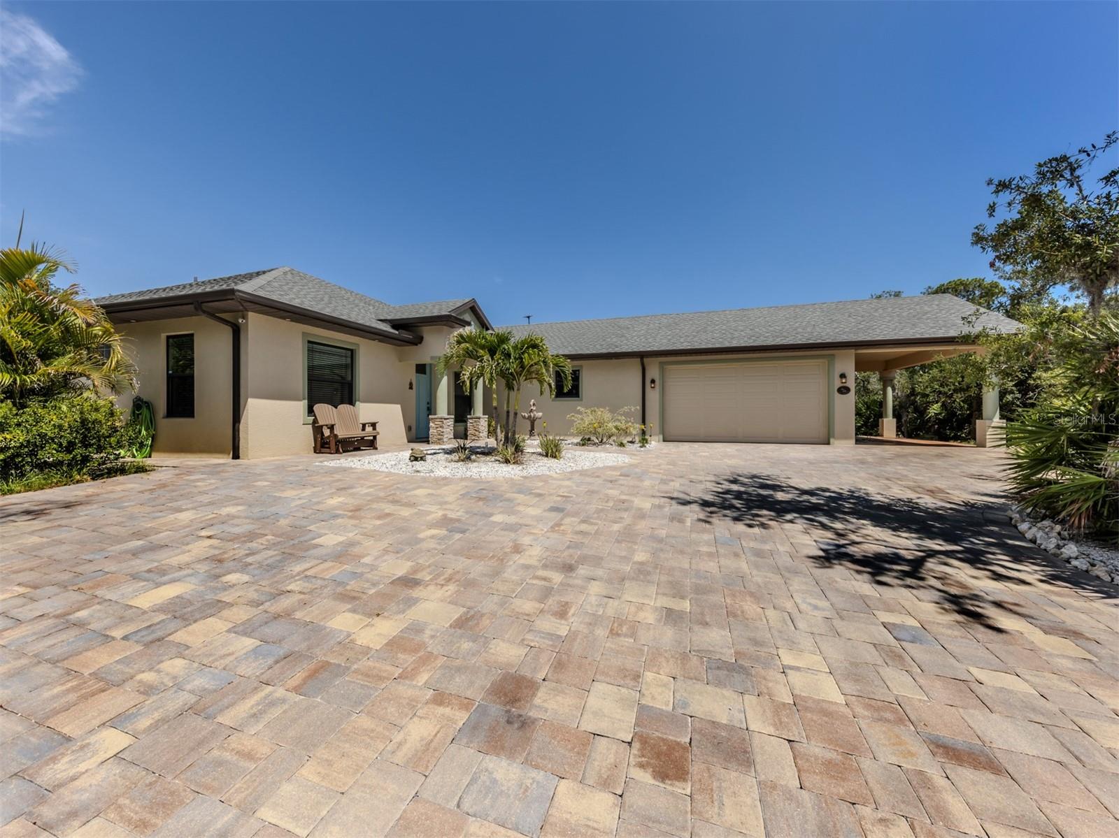 Welcome to your beach retreat, just the ideal private oasis in the heart of old Florida. You will be taken back to the Florida you can only dream about, and among the native vegetation is a lovely fireside-built home. The Cobia model has a nice-sized primary bedroom and two ample-sized guest rooms. The Cobia has a generous great room and dining area. There are two beautiful full baths. This floor plan is so well thought out, from the entrance on the extensive paver driveway, with plenty of parking for all guests you will welcome to this great home. There is a man cave or a great workout room, or exercise room, you decide how you will use this space. There is a two-car garage with a workbench area, as well as a carport. This area sure adds to the entertaining space as well. Now let’s take a visit out back to a large screened lanai complete with a spa/spool with a soothing waterfall to provide some lovely white noise. You are surrounded by private, native Florida foliage, with a pathway to the fire pit and a tranquil trail to explore and just take in the nature that abounds. The spacious, natural setting will keep you cool on a typical Florida summer day, relax with some time in a hammock. You are just a short distance to the water. You are also a quick trip to downtown Englewood to explore the farmers market, the shops and fabulous restaurants on Dearborn Street. We have world-class health care and theatre as well. Sarasota County will never disappoint, always something to do from festivals, entertainment and a celebration for every occasion. We are not too far from Wellen Park as well. See what 2565 Lemon Ave. and Englewood have to offer.