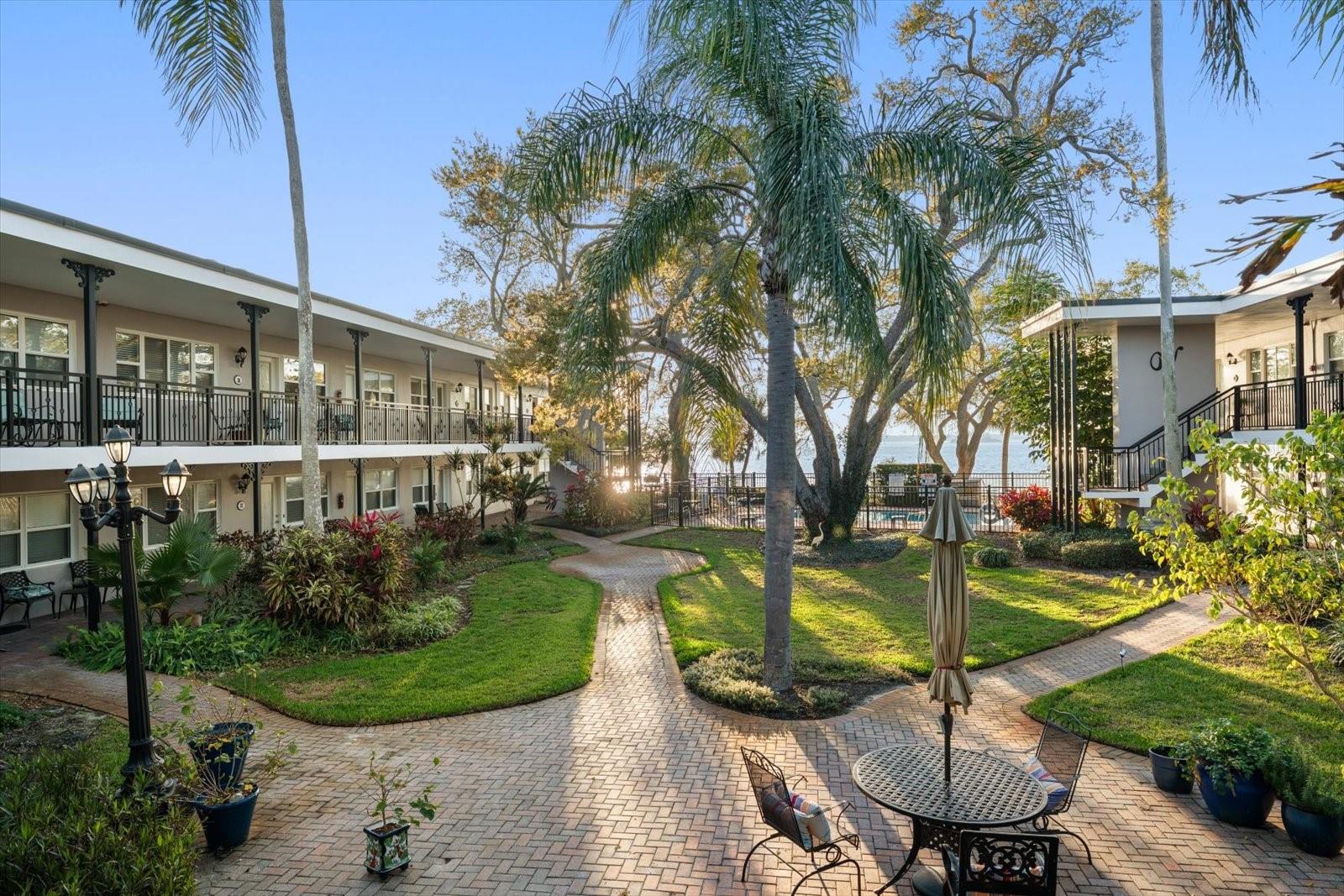 Escape to a slice of coastal paradise and seize the opportunity to own a remarkable waterfront condo that captures the essence of relaxation and old Florida charm. With its tranquil views of St. Joseph's Sound, this hidden gem located on coveted Victoria Drive offers an ideal winter getaway or lucrative investment opportunity. Victoria Condo is a true oasis with an intimate vibe, perfect for those looking for serenity. Listen to the waves lap the shore and watch mesmerizing sunsets from the lush courtyard and private pool. When you're ready for a bit of adventure, vibrant downtown Dunedin is just a few blocks away. Shops, restaurants, breweries, the marina and bike trail are mere steps from this tropical haven. Newer kitchen appliances! Monthly rentals permitted. This condo is being sold turn key for immediate enjoyment! No units at The Victoria flooded during Hurricane Helene!