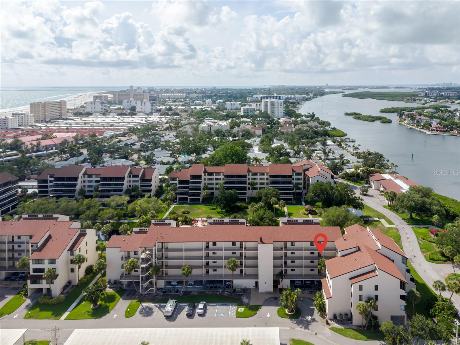 Experience the ultimate island lifestyle in this beautifully appointed 2-bedroom, 2-bathroom condo on world-famous Siesta Key.  
Located just steps away from the powdery white quartz sands of Siesta Beach, this property grants you your own private deeded beach access where loungers are waiting for you.  With the vibrant dining and shopping of the Village, this location cannot be beat.
You can be picked up right at the front of the building with free transportation on the island. The split bedroom living space area features Italian porcelain tile flooring, crown molding, abundant natural light, hurricane impact windows throughout, NO popcorn ceilings here-smooth as butter, seamlessly flowing onto a private lanai where you can enjoy your morning coffee with a peaceful view of the courtyard, pool, pond, a peak of the Bay, and beautiful grounds.  The community offers resort-style amenities, including two heated pools and hot tubs (one on the Bay side and one on the Gulf side), tennis courts, pickleball courts, a fitness center, shuffle board, fishing dock, grilling stations, library and a community room.  You will have an assigned covered parking space under the building,  ample additional parking for your guests and a storage unit for your beach toys.  Excelsior Beach to Bay also has a management company on site to rent your unit while you are away for your convenience, if you choose to do so.  You will love this close knit community and all the fun social events offered throughout the season.  Call for your private showing today.