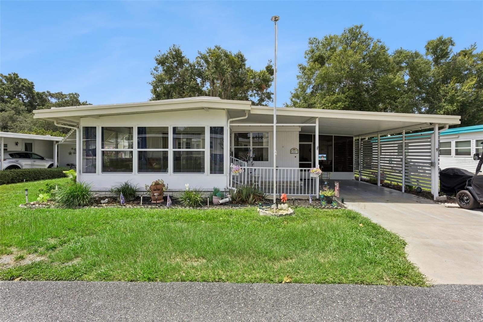 FURNISHED & TURNKEY ~ everything you need to start your FLORIDA ADVENTURE in this amenity-packed 55 plus community. 
This 2 BEDROOM, 2 BATHROOM home has been LOVINGLY MAINTAINED and RECENT MAJOR UPDATES INCLUDE:  2024
HVAC, 2017 ROOF, 2025 WATER HEATER, 2025 REFRIGERATOR, 2021nDISHWASHER & DISPOSAL, 2025 VAPOR BARRIER. 
EXTRAS include a SIDE LANAI & a FLEX ROOM that can be used as an OFFICE/DEN/TV/STORAGE ROOM ~ whatever you
choose.  TRANSFERABLE TERMITE BOND.  The home is situated on a lot with treed lot in the rear for LOTS OF PRIVACY an is on
CUL-DE-SAC STREET.  Its CLOSE PROXIMITY to the rear gate means you can make a quick trip for GROCERIES, GAS
STATIONS, BANKING, RESTAURANTS, & MUCH MORE!   HAWTHORNE is a PREMIER manufactured home CO-OP
COMMUNITY with a plethora of AMENITIES, ACTIVITIES & CLUBS.  INCLUDED in the monthly fee are:  24-HOUR GUARDED
GATE, CABLE, WATER, SEWER, COMMUNITY FACILITIES USE, ACCESS to HARRIS CHAIN of lakes, A BOAT SLIP, DOCK,
MARINA, POOL, TENNIS & PICKLEBALL COURTS, & so MUCH MORE!  See attachments for comprehensive list/details.