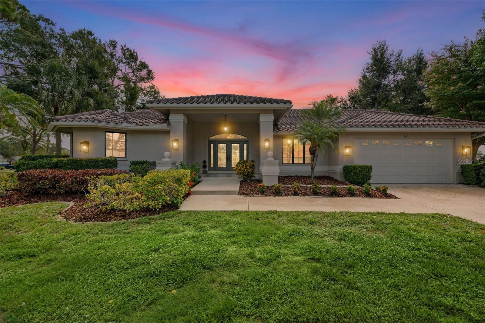 Welcome to your own private slice of paradise in the sought-after community of Sorrento Woods with low HOA fees and no CDD fees. Situated on an oversized lot of almost 0.40 acres with mature landscaping, tranquil pond views, and plenty of space between neighbors. This 3-bed, 2-bath pool home offers 2,661 square feet of space that embraces the best of Florida living. The covered front porch and French doors greet you as you step inside. The spacious living  as you enter feature vaulted ceilings and pocket sliding glass door that connects the indoor living spaces to the expansive screened lanai filling the home with natural light and the perfect setting for entertaining. The split-bedroom floor plan offers privacy for family and guests. The primary suite is complete with vaulted ceilings, private lanai access through sliding glass doors, two walk-in closets, dual vanities, a whirlpool tub, and a separate walk-in shower. On the opposite side of the home, 2 guest bedrooms each feature walk-in closets, with one offering direct access to the pool area through sliding glass doors. The guest bathroom also provides convenient access to the lanai, making pool days effortless. The eat-in kitchen features granite countertops, stainless steel appliances, and overlooks the family room with its vaulted ceilings and fireplace. Laundry room includes a utility sink along with the washer/dryer and additional storage closet. Step outside to your private backyard oasis where the expansive screened lanai, sparkling pool and spa, 1,200 sq ft of covered seating area, and pond views on two sides.  This home has ceramic tile and luxury vinyl plank flooring throughout with no carpet, providing easy maintenance. Residents of Sorrento Woods enjoy exclusive access to a private community boat launch and fishing pier on Shakett Creek with access to the Gulf, along with a playground, horseshoe pits, and bocce ball courts. Located just minutes from shopping, dining, and Gulf beaches, this exceptional property offers the perfect combination of privacy, convenience, and Florida lifestyle.