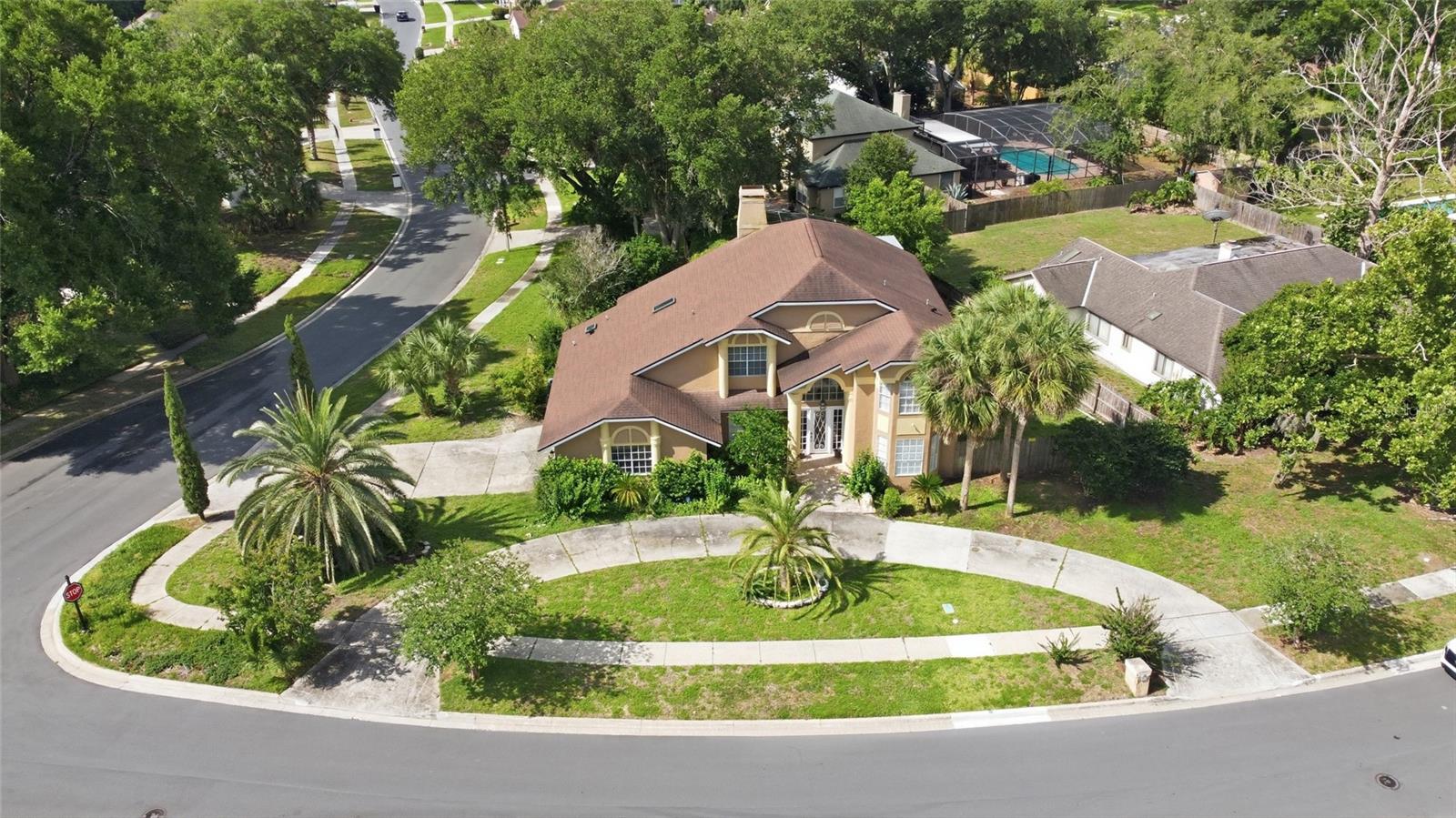 Nestled in the heart of Apopka and just minutes from Wekiwa Springs State Park, shopping, dining, and major roadways including I-4, this stunning 4-bedroom, 3-bathroom home at 2054 Palm Vista Dr offers 2,911 square feet of beautifully maintained living space inside the desirable Palms community.

Step inside to discover an open floor plan with vaulted ceilings and elegant crown molding throughout. The living room centers around a striking remodeled stone fireplace mantel, creating a warm and inviting gathering space. The kitchen features 42-inch shaker cabinets, quartz countertops, and stainless-steel appliances, perfect for everyday cooking and entertaining alike. NEW ELECTRICAL PANEL AND WATER HEATER HAVE BEEN INSTALLED.

The first-floor primary suite boasts high ceilings, an oversized walk-in closet, and French doors that open to the patio. The spa-inspired bathroom includes a walk-in shower, garden tub, and dual vanities. The main floor also offers a private office, formal dining room, full guest bath, and interior laundry room for added convenience.

Upstairs, one bedroom features oversized closets, a private den, and its own balcony, while two additional bedrooms share a full bathroom. Step outside to enjoy the screened-in pool, ideal for relaxing year-round in the Florida sunshine.

With convenient access to Downtown Orlando, world-famous theme parks, the airport, and so much more, this home delivers the perfect blend of comfort and location.

Schedule your private showing today and see why 2054 Palm Vista Dr is the place to call home!
