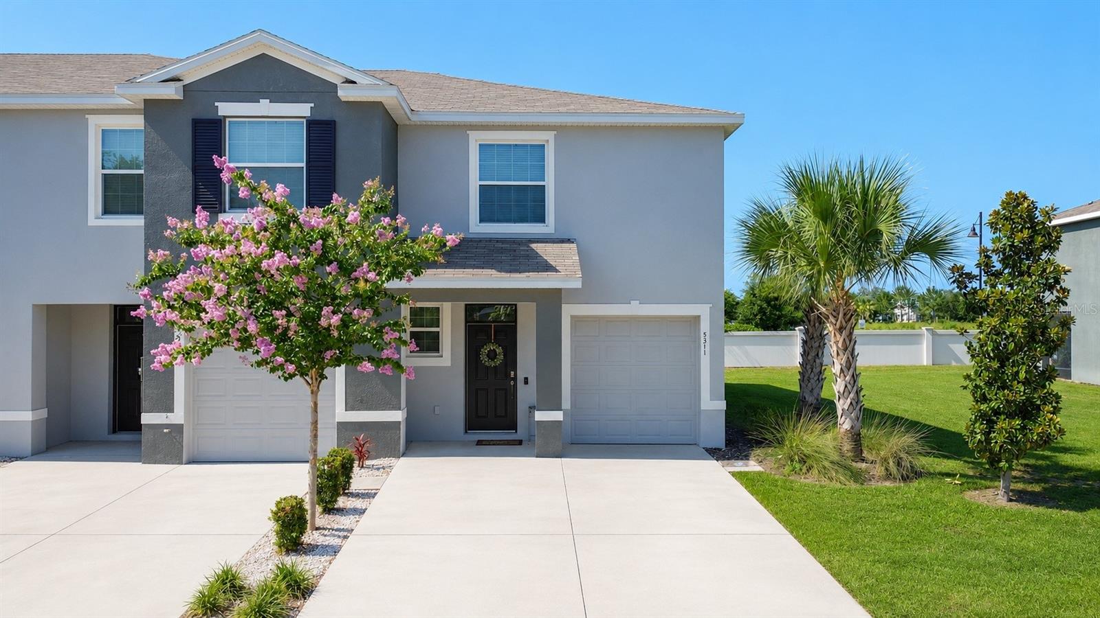 Seller Motivated! Beautifully maintained 3-bedroom, 2.5-bathroom end-unit townhome with a 1-car garage, offering the perfect blend of style, comfort, and convenience. All listing photos have been professionally staged with furniture and décor to help showcase the home's full potential. Step inside to an open and inviting floor plan featuring tile flooring throughout the main living area, soaring ceilings, and 8-foot sliding glass doors that fill the home with natural light while creating a seamless flow for everyday living and entertaining. The heart of the home is the spacious kitchen, featuring gray cabinetry, granite countertops, stainless steel appliances, a large center island, and a walk-in pantry providing exceptional storage. The kitchen opens effortlessly to the dining and living areas, creating the highly desirable open-concept layout today's buyers love. Upstairs, you'll find all three bedrooms, offering added privacy from the main living spaces. The spacious primary suite is a relaxing retreat with his-and-her walk-in closets and a private en-suite bath featuring dual vanities. The two guest bedrooms include luxury vinyl flooring, ceiling fans, and generous closet space, while sharing a convenient Jack-and-Jill bathroom. The upstairs loft provides a versatile bonus space that is perfect as a second living area, home office, study space, playroom, or kids' hangout area. An upstairs laundry room with a washer and dryer adds everyday convenience, and a half bath is located downstairs for guests. As a desirable corner/end unit, this home offers additional privacy and is one of the larger townhome floor plans within the community.  Conveniently located near shopping, restaurants, banking, medical facilities, and The Villages Town Squares, where you can enjoy free nightly live entertainment, this home is ideal as a primary residence, seasonal getaway, or investment property. Don't miss this opportunity to own a spacious, move-in-ready townhome in a fantastic location—schedule your private showing today!
