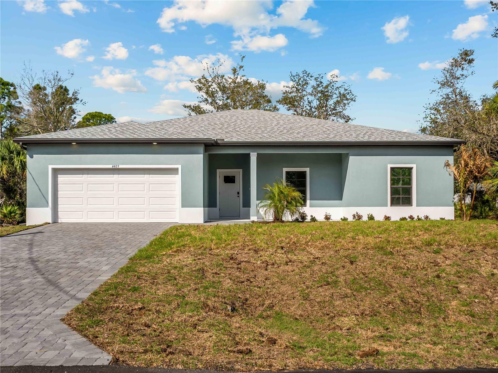 Virtually Staged. Tile throughout. Quartz countertops. Impact windows. Paver driveway. Whole-house generator plug. Fully upgraded new construction in North Port.

Flood insurance is not required for this property.

The layout is a 4-bedroom, 2-bath split floor plan with 2,111 square feet of living space. The open kitchen and living area work well for everyday living and entertaining. The primary suite is separated from the three secondary bedrooms, giving you flexibility for guests, a home office, or whatever you need the space to be.

No carpet anywhere. No vinyl. Tile throughout every room.

Impact-resistant windows are already in. The paver driveway is already in. The whole-house generator plug is already in. The builder did not cut corners on this one.

Buyers may be eligible for up to $5,000 in flex cash that can be applied toward closing costs or a rate buy-down.
Backed by a 2-10 Builder's Warranty.

Some photos are of the same floor plan and may not reflect current fixtures or colors in this home.