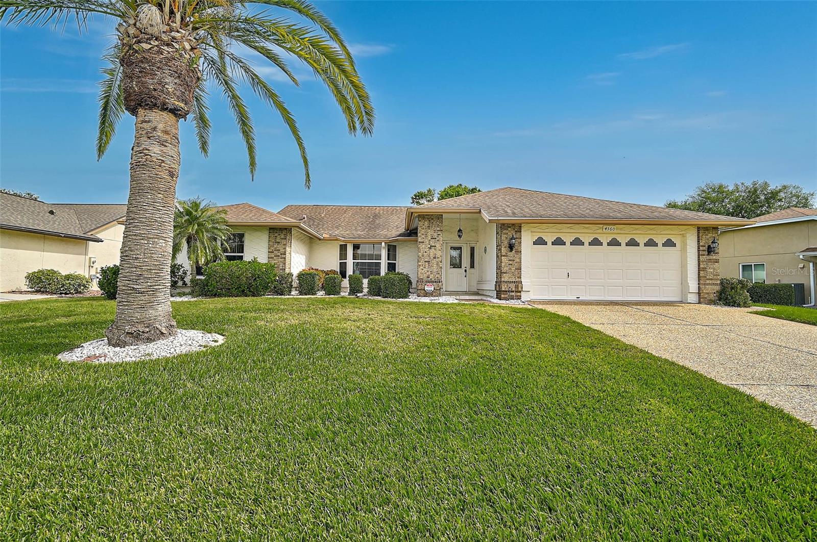 Price just reduced by $45,000—competitive new price point! Located in Peridia Golf & Country Club, this 3BR/2BA home offers desirable golf course frontage and a comfortable split floor plan. The interior features high ceilings and a light, bright atmosphere throughout. The kitchen includes Corian countertops, an eat-in area, and a conveniently located laundry room just off the kitchen, complete with a large sink and a spacious pantry. The large, glass-enclosed lanai with skylights provides additional living space and a great spot to relax. The primary bedroom is carpeted and features an en-suite bathroom with double sinks, a separate tub, and a walk-in shower. The roof was replaced in 2014. Residents of Peridia Golf & Country Club enjoy access to a variety of amenities, including an 18-hole executive golf course, tennis and pickleball courts, water aerobics, Mah Jong, a book club, bingo, and live music on Friday nights. The renovated Tiki Bar adds even more to the vibrant community atmosphere. Quarterly Master Association fee: $938, Annual Food/Beverage minimum: $600, One-time Application Fee: $100, One-time Capital Reserve: $4,000. Contact us today to schedule your showing and learn more about this opportunity to join the Peridia lifestyle!