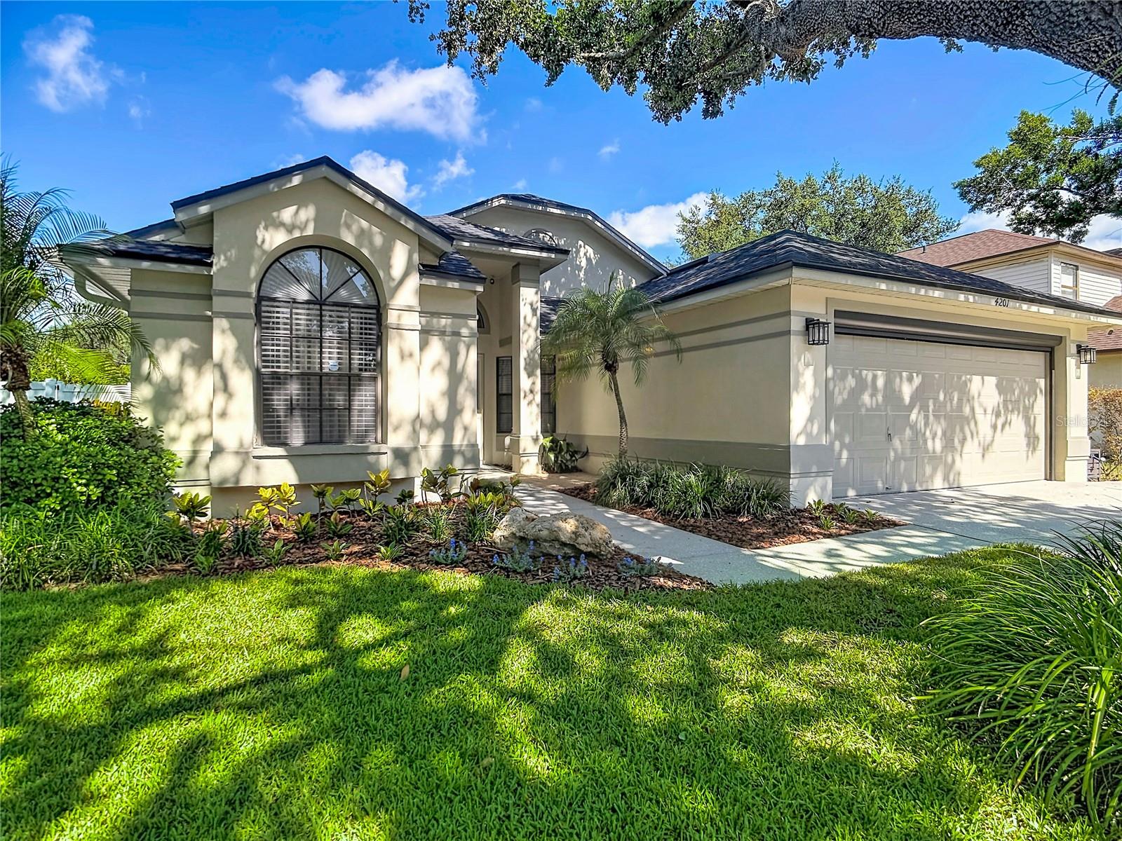 Welcome to this beautifully maintained 3-bedroom, 2-bath pool home in the highly desirable Walden Lake community of Plant City. Move-in ready and thoughtfully updated, this residence offers the ideal blend of comfort, style, and peace of mind with major improvements already completed. Enjoy the best of Florida living in your heated pool and spa, recently refinished and ready for year-round relaxation. The outdoor space is equally inviting, featuring mature landscaping, a full irrigation system, and plenty of room to entertain or unwind. Inside, the home showcases tasteful upgrades throughout, including plantation shutters, Pottery Barn curtain rods and custom curtains, and a well-equipped kitchen with stainless steel LG appliances. An LG washer and dryer are also included, adding even more convenience for the next owner. This home stands out for its impressive list of major updates, including a new 2026 roof, A/C replaced in 2021, and a tankless water heater that provides energy-efficient, endless hot water. The immaculate garage offers a clean, organized space ideal for vehicles, storage, or hobbies. Located close to shopping, dining, schools, and major roadways, this exceptional Walden Lake property offers both everyday convenience and lasting value. With so many upgrades already in place, this is a rare opportunity to own a beautifully updated home in one of Plant City’s most sought-after communities.