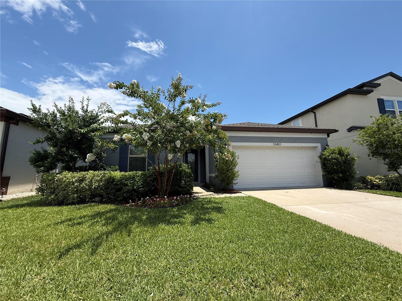 MOVE-IN READY***SINGLE-STORY HOME***HIGH CEILINGS***HURRICANE SHUTTERS***OVERSIZED TANDEM SPACE GARAGE! This beautifully maintained home offers 3 spacious bedrooms, 2 bathrooms, and 2,025 square feet of thoughtfully designed living space featuring HARDWOOD FLOORING throughout the main living areas, and tile in the bathrooms and laundry room. Step inside to a welcoming foyer that opens to an inviting, OPEN-CONCEPT floor plan. The spacious kitchen is the heart of the home, featuring a LARGE CENTER ISLAND WITH SINK and breakfast bar seating, abundant counter space, a WALK-IN PANTRY, and seamless views of the dining and living areas, perfect for everyday living and entertaining. Designed with privacy in mind, two secondary bedrooms and a full bathroom with a tub/shower combination are situated at the front of the home, while the private primary suite is tucked away at the back of the home. The spacious owner's retreat features a DUAL SINK VANITY, an OVERSIZED WALK-IN SHOWER with a BUILT-IN BENCH, a private water closet, and a large WALK-IN CLOSET. Sliding glass doors from the great room lead to the COVERED LANAI, where a charming PORCH SWING BED overlooks the beautifully landscaped backyard enclosed by vinyl fencing for added privacy. Additional highlights include a generously sized INDOOR LAUNDRY ROOM and an OVERSIZED GARAGE, complete with a UTILITY SINK and a TANDEM SPACE that offers incredible flexibility and is ideal for extra storage, a workshop, home gym, or hobby area. Located in the desirable Ventana Groves community, this home is just 3 minutes from I-75, approximately 15 minutes to the Brandon Exchange shopping and dining district, 20 minutes to downtown Tampa, 30 minutes to Tampa International Airport, and about 40 minutes to the beautiful Gulf Coast of Florida beaches. This exceptional home offers the perfect blend of privacy, functionality, and modern living. Schedule your private showing today!