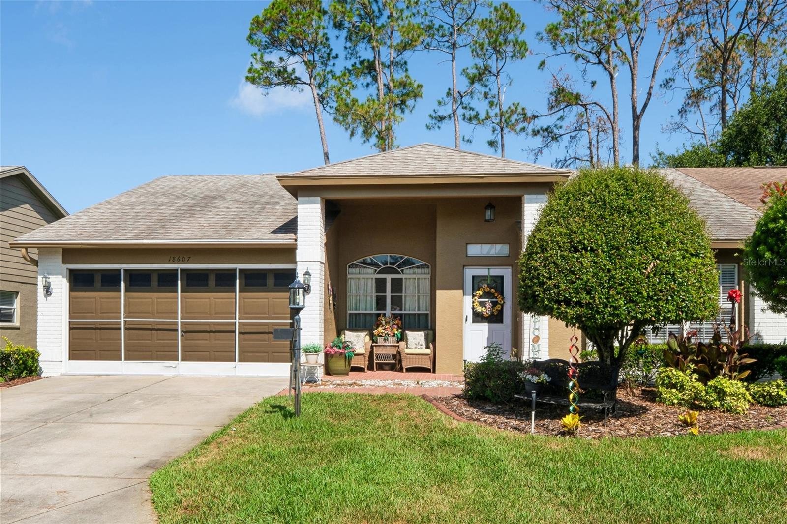 Stunning Golf-Course Villa in Heritage Pines! 
Experience carefree Florida living in this beautifully maintained end-unit villa, perfectly positioned to capture serene golf course views on the 13th fairway with no rear neighbors. This spacious home features two bedrooms, two bathrooms, a sitting room, and a two-car garage.

Step inside to formal living and dining rooms, ideal for entertaining. The open eat-in kitchen overlooks the inviting family room, creating a comfortable and functional layout. The primary suite offers peaceful views along with an en-suite bathroom featuring dual sinks, sun tube and a walk-in shower. A private guest bedroom and adjacent hall bath with a sun tube provide the perfect space for visitors.

Additional highlights include an inside laundry room and a versatile den/sitting room—perfect for a home office or hobby space. No carpet all tile. Relax on the back patio and enjoy tranquil golf course views in your own private retreat.