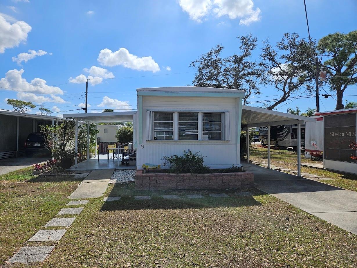 Welcome to Oak Grove! This beautifully updated 2-bedroom, 1-bath home is located in the desirable 55+ Oak Grove community in Englewood. Light and bright, the home offers a comfortable, functional layout designed for easy Florida living. Major updates completed just three years ago include the roof, kitchen, subfloor, flooring, cabinets, countertops, stove, patio roof, carport, and a modern walk-in shower. Recent improvements such as a new insulated duct return and toilet provide added comfort and efficiency. The home is being sold fully furnished and is move-in ready. Oak Grove is a resident-owned cooperative mobile home and RV park where homeowners are members and shareholders of the association. Community amenities include a heated/cooled pool with an expanded deck and new cage (2024), recreation hall, lending library, laundry facilities, shuffleboard courts, billiards, butterfly garden, and dog walking area, along with regular social events and activities. Ideally located near Manasota Beach, Dearborn Street, shopping, dining, and local entertainment, this home offers both convenience and an active lifestyle. Schedule your private showing today!