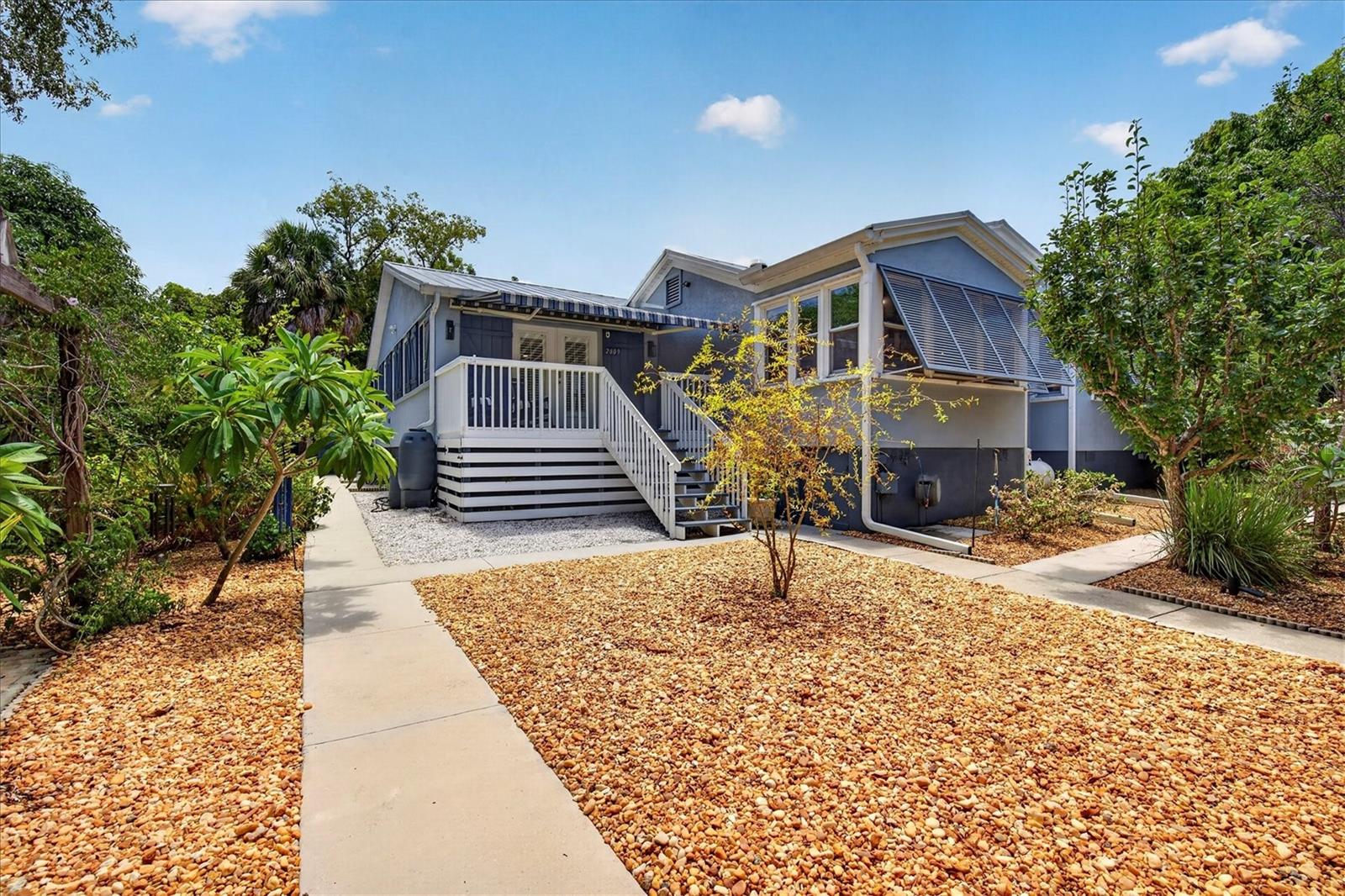Turnkey Move-In Ready | Custom Elevated Home on 0.59 Acres – No Flood Zone, No HOA
This stunning, fully updated custom-built home sits on a beautifully landscaped corner lot with exceptional privacy and endless possibilities.  The original part of the house is a historic Florida farm cottage updated with an addition add in 2004.  Completely remodeled and meticulously maintained, it offers a bright, airy open floor plan perfect for modern living and entertaining.

The spacious great room features custom entertainment cabinetry and flows into a true gourmet kitchen boasting porcelain countertops, solid wood KraftMaid cabinets with soft-close pull-outs, premium stainless appliances including a Jenn-Air double oven, Thermador Professional gas range, LG dishwasher and LG French-door refrigerator. A separate living area with fireplace with electric heater insert makes an ideal den, office, or easy 4th bedroom conversion.

The primary suite is a true retreat with a luxurious remodeled bath featuring a large walk-in shower and elegant claw-foot tub. A large laundry/utility room and abundant storage complete the thoughtful layout.

Additional Upgrades Include: 50-year metal roof (2024). Built out the Guest Cottage (2024), Water Softener (2023), New Well Pump with whole-house water filtration, On Demand Gas Water Heater for Main House , Electric On Demand Water Heater for Cottage, 100 Gallon Propane tank just to name a few.

Bonus Self-Sufficient Cottage
A fantastic porcelain-tiled guest/in-law suite with full kitchen, full bath with large walk-in shower — perfect for extended family, guests, or income production (currently counted as the 3rd bedroom and 3rd bath).

Outdoor Paradise
Enjoy 15+ varieties of fruit trees (Mango, Avocado, Persian Lime, Meyer Lemon, and more), new sidewalks, an expanded carport, hurricane protection on all windows and a covered/screened outdoor living area ideal for private entertaining. This lush, low-maintenance .59-acre lot feels like your own private oasis. Worth noting the home received no damage from recent hurricanes Helene and Milton

Prime Palm Harbor Location
Just steps from the Pinellas Trail, in the highly rated Palm Harbor University school district, and a short drive to Tarpon Springs Sponge Docks, historic Dunedin, and world-class beaches at Honeymoon and Howard Island State Parks.

This rare combination of a fully updated custom home, income-producing cottage potential, abundant fruit trees, and prime location on a large private lot won’t last long. Check out the website. A true must-see for buyers seeking something truly special. Schedule your private showing today!