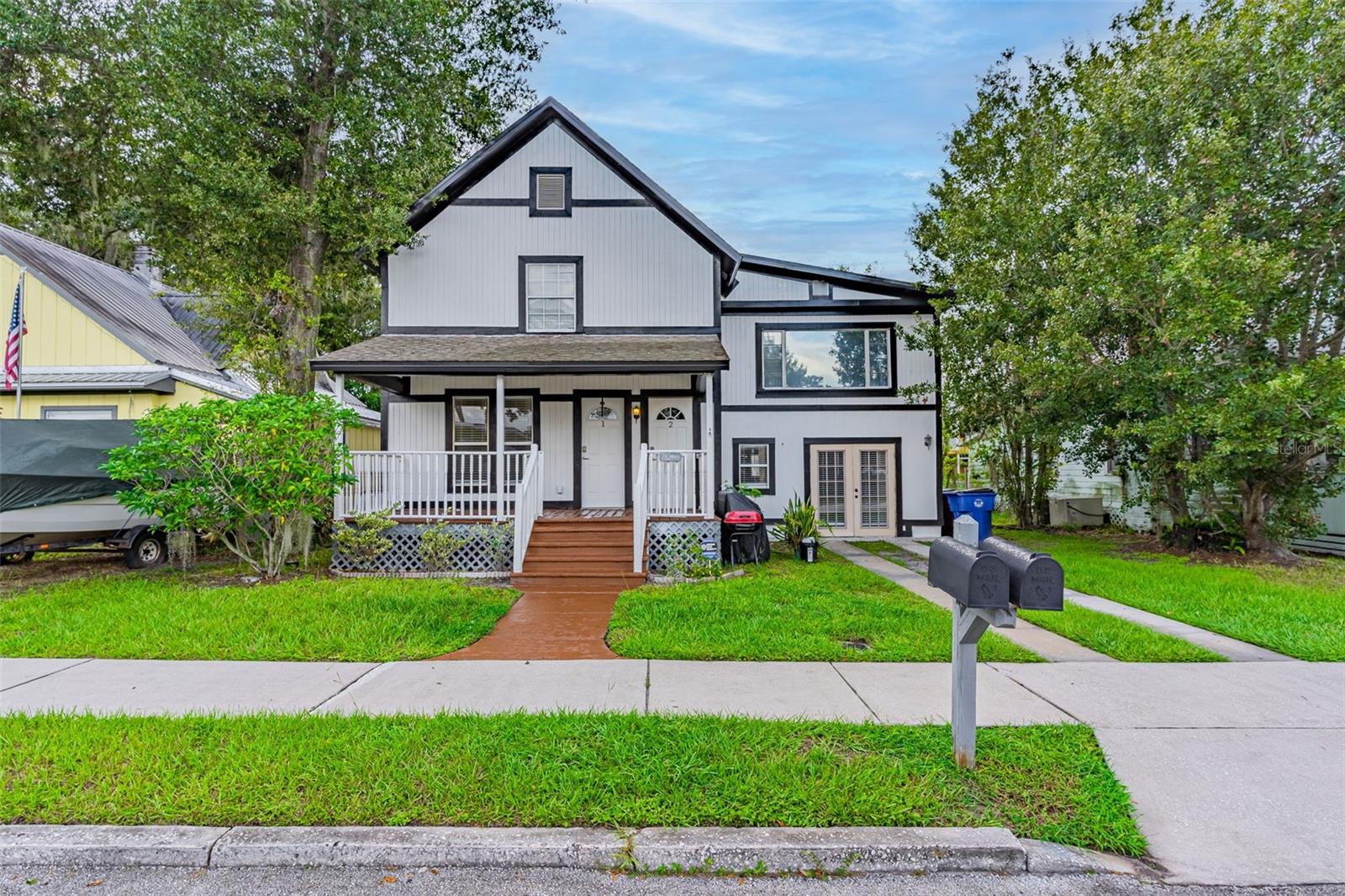 BACK ON MARKET AS WE WERE WAITING FOR TENANT TO VACATE....Gorgeous Duplex located in Historic Downtown St. Cloud! The main residence on the first floor offers 2-bedrooms and 2-bathrooms, while the second-floor in-law suite, features 2-bedrooms and 1-bathroom with an open-concept design. The main house's kitchen is a standout feature, showcasing a charming tongue-and-groove cathedral ceiling, sturdy oak cabinets, a brand-new range, and a built-in microwave. The luxurious master bedroom includes an exquisite master bath, with the latter comprising two distinct rooms that seamlessly connect. This master bath offers a generously sized built-in tub with premium amenities, a new vanity, ceramic tile, and stylish lighting. Additionally, it boasts an expansive fully tiled walk-in shower and an exceptionally spacious master bedroom with French doors, laminate flooring, and a walk-in closet. The main house also comprises a separate dining room, living room, guest bedroom, and a second bath. Recent updates include fresh paint and the replacement of most of the flooring. The property also features a new AC system, a fully fenced backyard with a firepit, a sizable 10x15 storage shed, and convenient access via an open alley at the back of the property. Enjoy your evenings on the welcoming covered front and back porches, perfect for taking in picturesque sunsets. The in-law suite has its own private entrance on the second floor and offers a kitchen and living room combination with charming wood-beamed ceilings. It includes two bedrooms and a modern bathroom with a new vanity, mirrors, and lighting. The bathroom features a bath and shower combination, and the suite is finished with laminate flooring and an interior utility space. The entire space is tastefully designed and is sure to impress any discerning buyer. This property is ideally located just three blocks away from downtown St. Cloud, offering easy access to a variety of restaurants and shopping options. It is also conveniently close to the St. Cloud Lakefront and public transportation. Major highways, the Orlando Airport, hospitals, and additional shopping are all within easy reach. Viewing this property is a pleasure, and it is sure to leave a lasting impression.