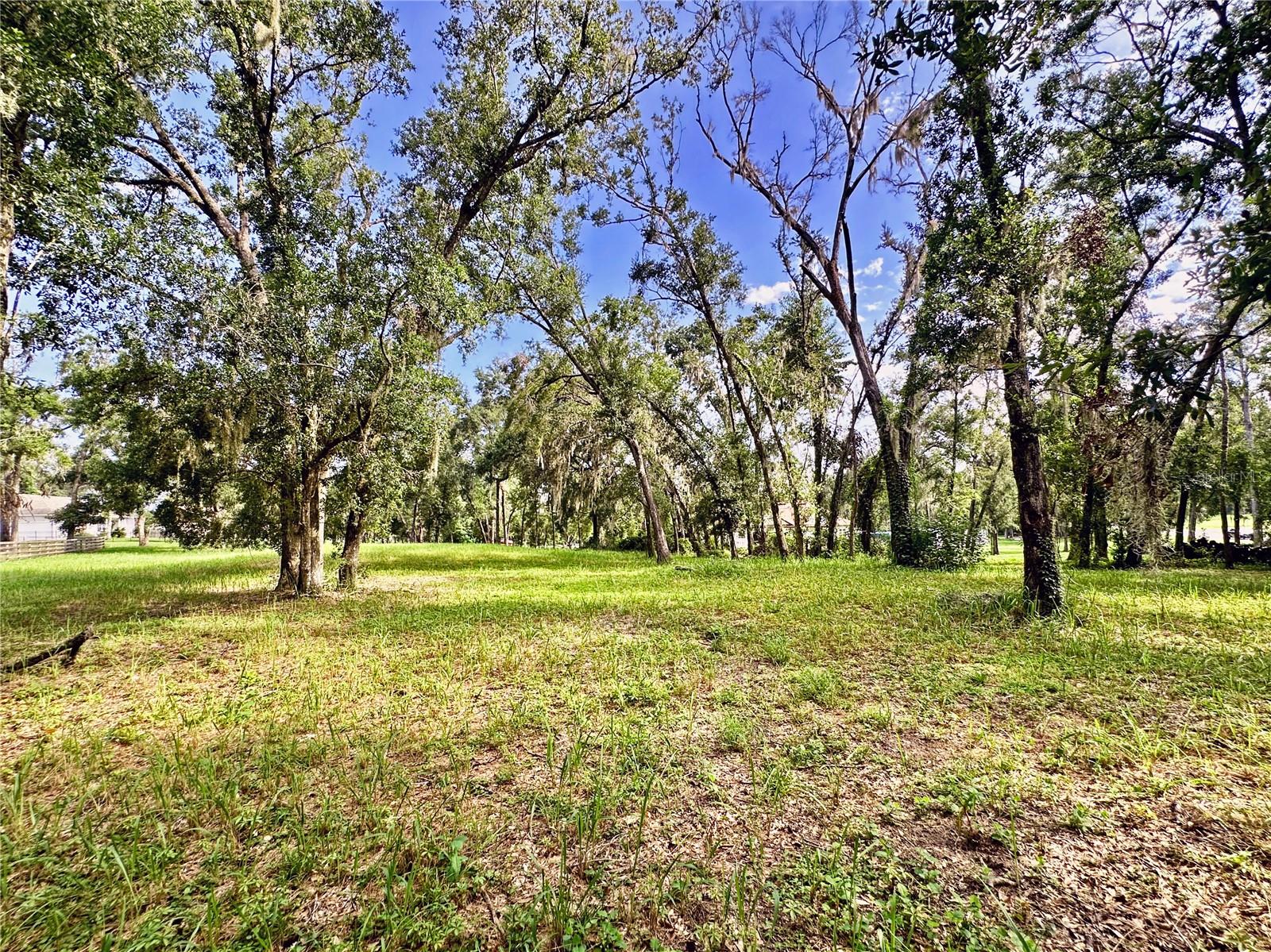 REFRESHED PRICING on this build-ready gem in desirable Dade City. Build your private estate on 1.2 acres in the rolling hills. This high-and-dry homesite rests in Flood Zone X, offering peace of mind and lasting stability, while no HOA means the freedom to design a residence as unique as your vision. With ample room for a sprawling custom home, pool, and even a guesthouse or in-law suite, the possibilities are endless. Mature oaks frame the property in natural beauty and privacy, while lightly cleared frontage makes access and build prep easy.

Utilities are nearby and septic is required, so the groundwork is set for your future build. Perfectly positioned near Lake Jovita Golf & Country Club, St. Leo University, the Mirada Lagoon, and historic downtown Dade City, this location blends small-town charm with modern convenience. Just minutes to Wesley Chapel and less than an hour to Tampa or Orlando, you’ll enjoy seamless access to shopping, dining, and entertainment while retreating home to the quiet luxury of the countryside.

For added peace of mind, we work with lenders experienced in land loans and with builders approved for construction-to-perm financing—available to assist in designing and building your new home if desired, though there is no obligation.

This is more than land—it’s the canvas for your forever home and the beginning of your legacy.