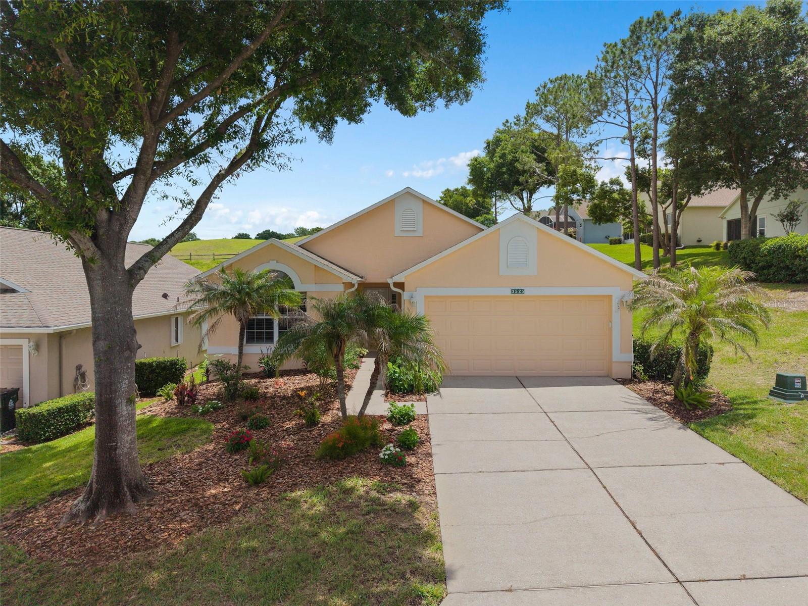 Welcome to this beautifully updated 2-bedroom, 2-bath home with a 2-car garage located in the highly sought-after Aberdeen neighborhood within Kings Ridge, Clermont’s premier 55+ gated golf community. Offering 1,548 square feet of living space, this move-in-ready residence combines comfort, style, and the ultimate Florida lifestyle. Step inside to discover an open floor plan with high ceilings, abundant natural light, and elegant plantation shutters that add timeless charm throughout the home. The recently remodeled kitchen features stunning new cabinetry, elegant Corian countertops, and ample workspace perfect for entertaining or everyday living. Both the primary and guest bathrooms have also been tastefully updated with modern finishes. This home also features a desirable Florida room and an expansive three-panel sliding glass door that opens to a generously sized screened-in porch, creating the perfect indoor-outdoor living experience to enjoy Florida’s beautiful weather year-round. Flooring throughout the home includes a blend of laminate, tile, and carpet for both style and comfort. Additional upgrades include a recently updated HVAC system in May 2026, providing peace of mind and energy efficiency. The roof was replaced in August 2018. Residents of Kings Ridge enjoy the renowned “Royal Lifestyle” with access to a multimillion-dollar clubhouse offering three heated pools, spas, tennis courts, pickleball courts, billiards, shuffleboard, bingo, cards, live entertainment, and countless clubs and social activities. The monthly HOA fees provide exceptional value and include lawn maintenance, shrub trimming, irrigation system maintenance and water, Spectrum cable TV and internet, road maintenance, and exterior home painting every seven years. Conveniently located, residents can take their golf cart directly to Kings Ridge Plaza for grocery shopping, banking, dining, and everyday conveniences. This is Florida active adult living at its finest!