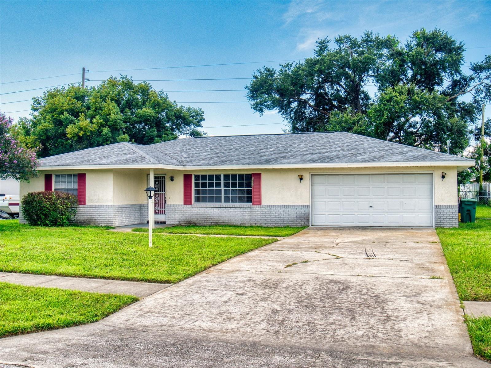 Large 2 bedroom, 2 bath home in a great location only minutes to I-4, the Orlando Metro Area, and the beaches. Great floor plan with a good sized tiled kitchen and dining area, oversized bedrooms, a big inside tiled laundry/utility room, and a huge trussed in rear screened porch overlooking the fenced backyard. Roof installed in 2018, and a newer AC and water heater as well. This one just needs some cosmetic work and then will be ready for immediate occupancy,
