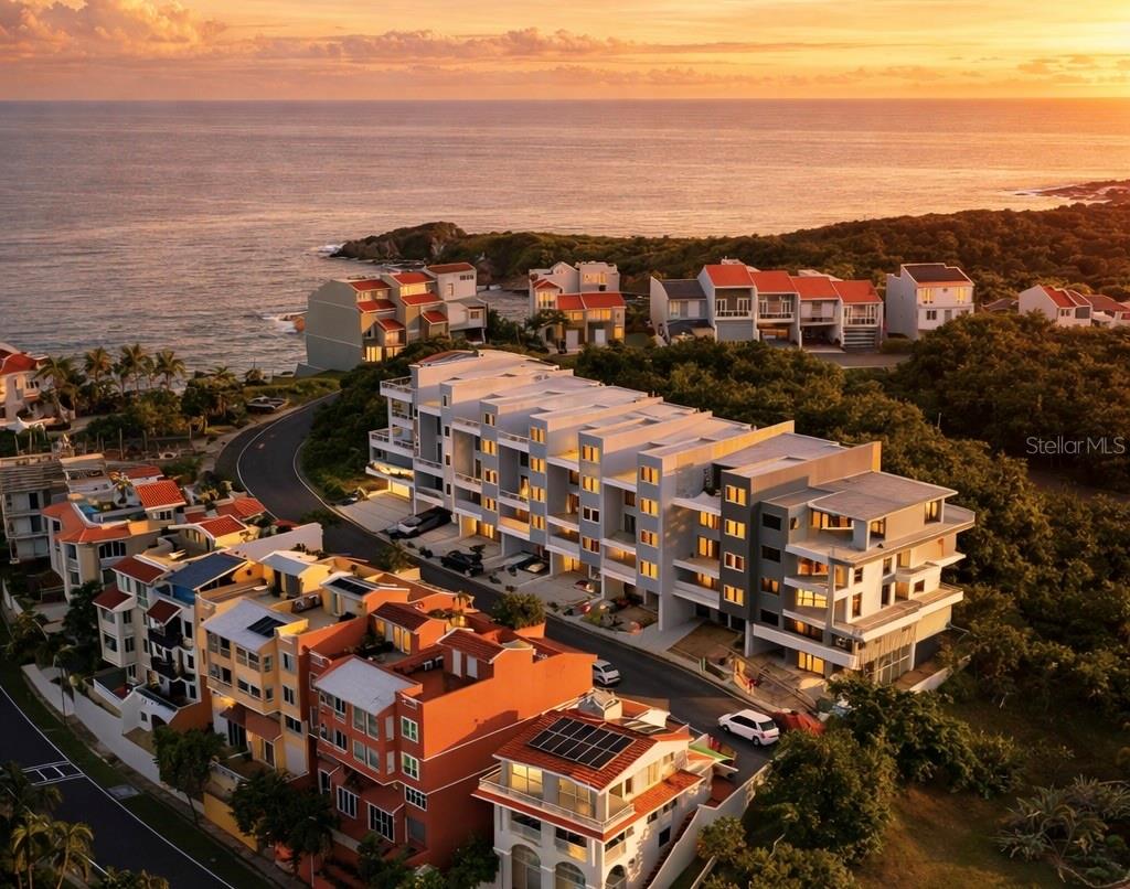 One or more photo(s) has been virtually staged. Under Construction. This 4-bedroom townhouse, currently under construction, offers the opportunity to shape a coastal lifestyle within the Breeze Point enclave of Palmas del Mar, while securing pre-construction pricing subject to adjustment upon completion.

Designed for those who value space, light, and flow, the residence offers approximately 4,400 square feet of interior living space, complemented by 1,497 square feet of balconies and terraces that invite the outdoors in. Double-height ceilings in the living area, expansive ocean views, and constant cross-ventilation create an atmosphere that feels open, relaxed, and naturally connected to the tropical setting.

Spread across five levels, the home adapts effortlessly to the rhythm of daily life. Whether hosting gatherings, working remotely, welcoming guests, or creating spaces for wellness and entertainment, each level can be tailored to reflect how you live today—and how you envision living in the future. The rooftop terrace becomes a natural extension of the home, ideal for sunset moments, evening conversations, and open-air entertaining. An elevator shaft is already in place, offering seamless potential for future convenience.

At this stage, the residence remains a blank canvas, allowing the layout and experience of each floor to evolve around your lifestyle, preferences, and long-term vision.

Set on a quiet cul-de-sac, just steps from the beach, within a gated community with 24/7 security, the property balances privacy with access to the resort-style amenities that define life in Palmas del Mar—where days are shaped by the ocean, outdoor living, and a sense of ease that carries through every season.

Schedule your private visit and experience the lifestyle potential of Breeze Point #48.