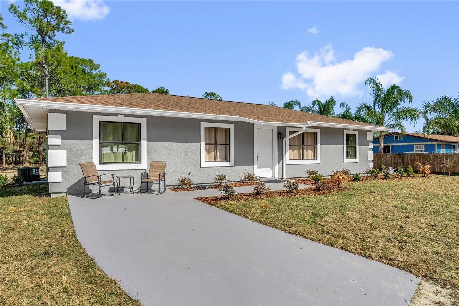 Move in ready home on acreage provides freedom you've been looking for. Inside, enjoy a fresh contemporary design with granite countertops, brand new stainless appliances and remodeled bathrooms. outside, a new 22x24 foot garage with electricity. Ideally located about 20 miles from Cocoa Beach and 21 miles from Kennedy Space Center, Blue Origin, and SpaceX, with easy access to Orlando, this property delivers country living and convenience. Come see!