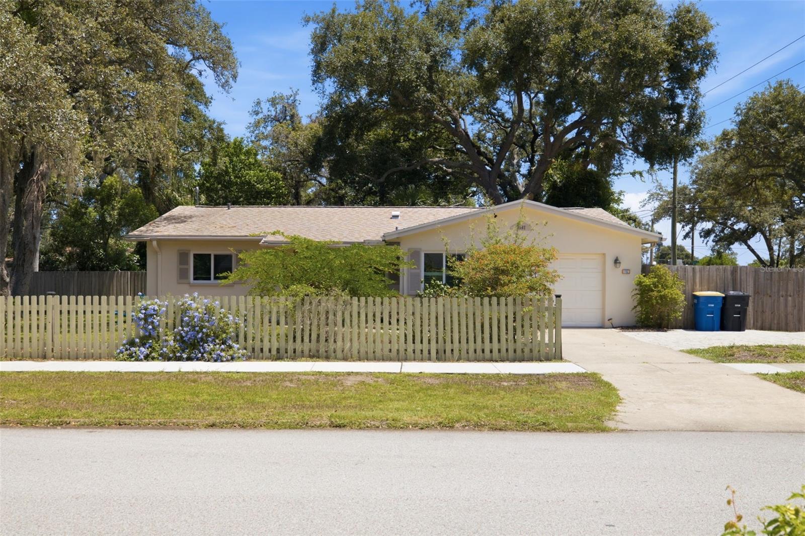 Located on the Clearwater/Dunedin border and just 1 mile from Downtown Dunedin, this 3-bedroom, 2-bathroom home offers a rare combination of space, flexibility, and location. Situated on an oversized double lot, the property provides ample room for boat and RV parking, future expansion, a pool, or simply enjoying the extra outdoor space—without the restrictions of an HOA. Inside, you'll find a functional layout featuring a spacious primary suite with an en-suite bathroom. Hurricane impact windows in the bedrooms, kitchen, and bathrooms provide added peace of mind, while major updates including a 2018 roof, 2022 HVAC system, and new ductwork help make this home move-in ready.
Step outside and enjoy Florida living year-round with a screened-in patio, tiki bar, and a storage shed with electricity, perfect for a workshop, hobby space, or additional storage. The expansive backyard offers endless possibilities for entertaining, gardening, or creating your own private outdoor retreat.Conveniently located just minutes from Downtown Dunedin's restaurants, breweries, waterfront parks, and the Pinellas Trail, this home is also near TD Ballpark, home of Toronto Blue Jays Spring Training. Spend your weekends exploring Downtown Dunedin, catching a ballgame, biking the trail, or heading to Clearwater Beach, Honeymoon Island, and Caladesi Island—all just a short drive away. Offering a rare combination of a double lot, non-flood zone location, boat and RV parking, and no HOA, this property delivers the space and flexibility to enjoy the Florida lifestyle your way.