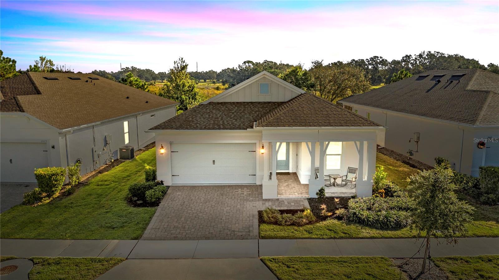 St. Lucia Model home at its best. K. Hovnanian's Four Seasons at Orlando in Kissimmee is a private gate guarded 55+ community only minutes from the Disney theme parks. This one year old home features three bedrooms, two full baths, luxury kitchen, a 12 foot island quartz counter tops, Gas cook top and wall oven, extended master suite, two additional bedrooms and a guest full bath. The entire home has luxury vinyl flooring and a triple slider to the lanai. Upgrades include: whole house 6" gutters with 3x4 downspouts (6 splash blocks), two car garage with titan garage flooring solutions (hybrid Polyurea and Polyaspartic lifetime transferable warranty). Window treatments: Poly Core Plantation Shutters 4.5 louvers with bottom sill cap in the dining room (2), primary bedroom (1 large window), front bedroom (1) with honeycomb manual blackout shade, middle bedroom (1) with Hunter Douglas Applause 3/4" semi-opaque honeycomb, great room patio sliding doors w/power rechargeable battery motorization - hand held remote plus (5) remote fans. Ring flood lights/camera wired and added to lanai and front ring door bell wired and installed. The two car garage has Craftsman one workbench, three overhead storage cabinets. Stair access in the garage for storage and water purification & filtration system installed.  All the upgrades on this one year home equals over $45,000. You will love living in this 55+ community with so many activities at the clubhouse. Enjoy the two heated pools with an additional lap pool, pickleball, tennis and bocci ball courts. The Clubhouse has a game room with ping pong and pool, card room, exercise room, full gym with private showers and locker room, kitchen and a grand ballroom. We have community parades, golf cart contests, line dancing, cooking lessons, arts and crafts. We are next to Mystic Dunes Golf Club and have access to the restaurant and golfing. Taxes and CDD are grouped together at the tax office.