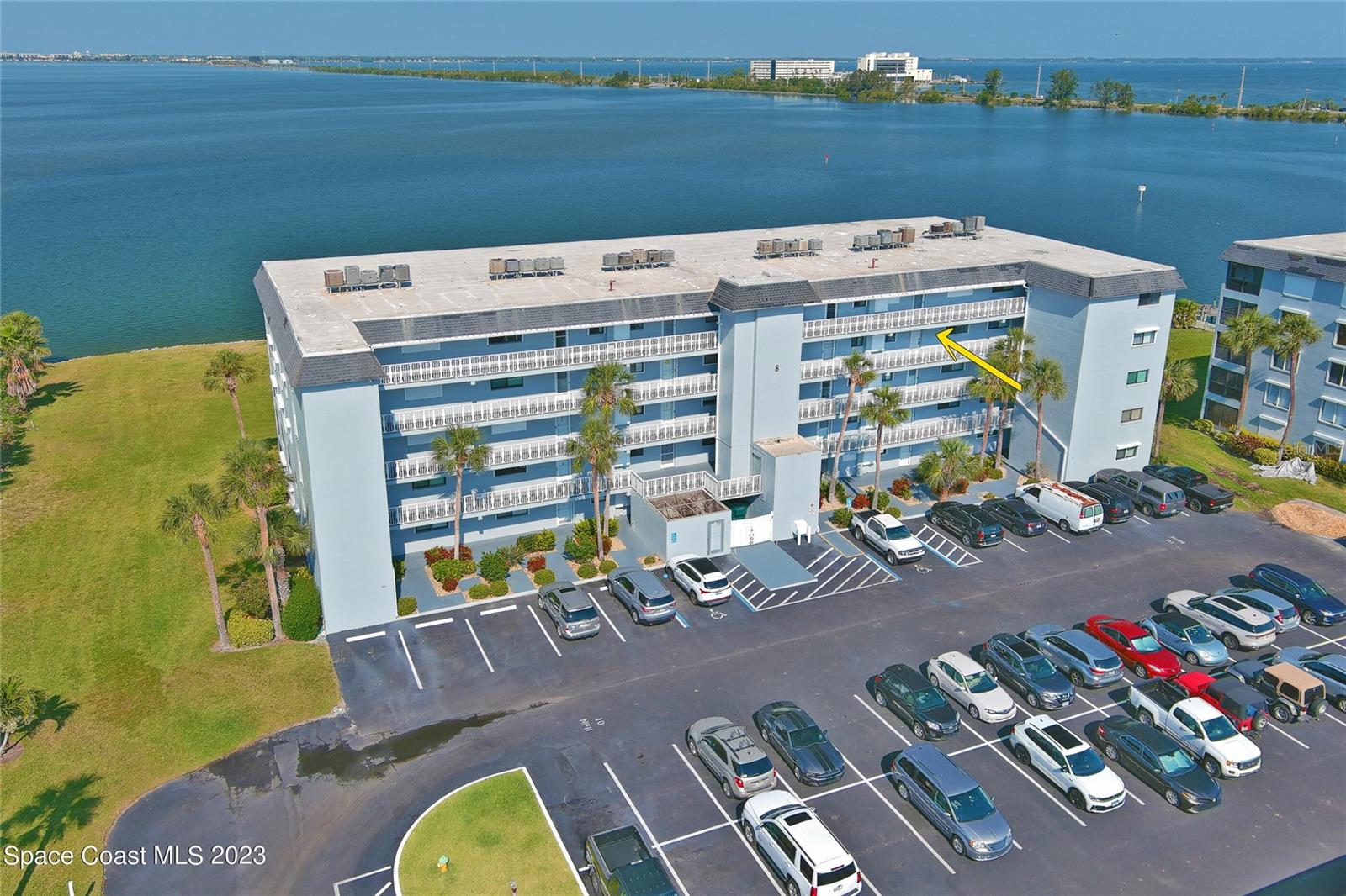 Experience the best of waterfront living in this beautiful riverfront condo overlooking the Banana River. Enjoy breathtaking sunsets, frequent sightings of dolphins and manatees, and front-row views of spectacular rocket launches from your private balcony. Expansive sliding glass doors fill the living spaces with natural light and seamlessly blend indoor and outdoor living. The well-appointed interior features stainless steel appliances, a convenient wet bar for entertaining, and hurricane shutters for added peace of mind. A private one-car garage provides valuable storage and parking convenience. Residents enjoy resort-style amenities including two community pools, boat docks, a boat launch, and a clubhouse, offering endless opportunities to embrace Florida's outdoor lifestyle. Ideally located near the Cocoa Beach Pier, area restaurants, shopping, and entertainment, this property combines waterfront tranquility with everyday convenience.