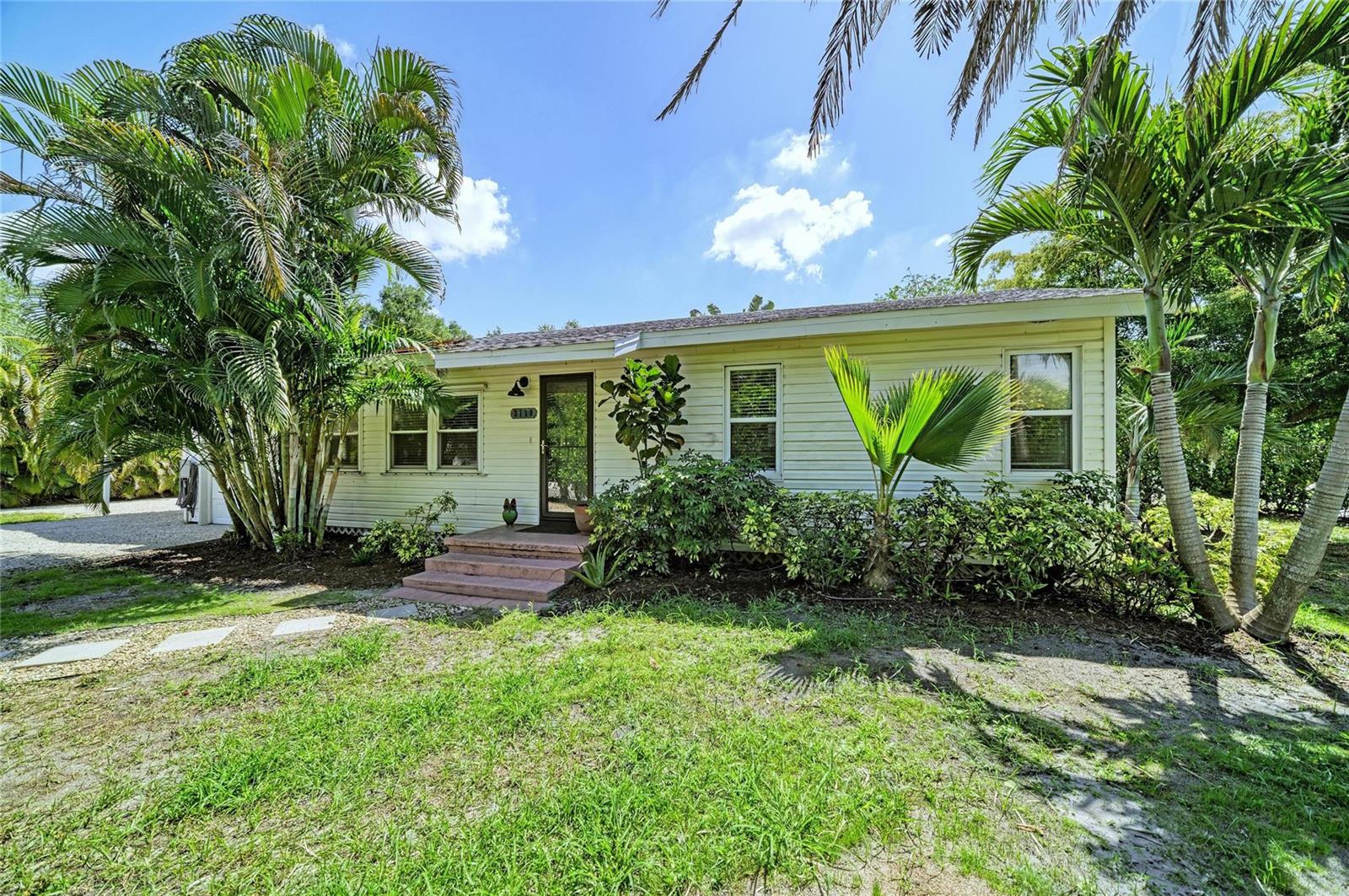 One or more photo(s) has been virtually staged. Welcome to 3710 Rilma Avenue! This welcoming cottage home is conveniently located just minutes from downtown Sarasota, the Sarasota-Bradenton International Airport, New College of Florida, the University of South Florida and Ringling College of Art and Design, offering access to a range of cultural, educational and lifestyle amenities. The home features three bedrooms plus a flexible bonus room suitable for an office or additional living space. The kitchen has been updated with granite countertops and stainless-steel appliances, providing durable surfaces and modern functionality. Interior comfort is enhanced by energy-efficient double-pane windows. The exterior of the property is defined by established Clusia hedges that provide privacy, along with mature palm landscaping surrounding the residence. Additional outdoor features include an outdoor shower and an irrigation system from a well. Parking and storage options include a one-car garage, a one-car carport and additional space suitable for a boat or recreational vehicles. With no HOA or deed restrictions, this residence presents a compelling opportunity for a first-time home buyer, an investor seeking property within Sarasota city limits where short-term rentals are permitted, or anyone simply looking to relocate to beautiful Sarasota.