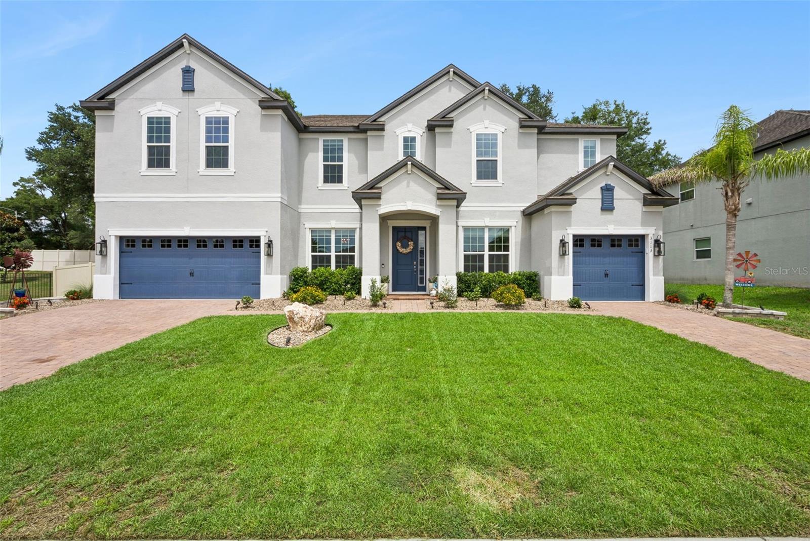 Welcome to Hillside at Wekiva and this Stunning Two Story Estate Home featuring 7 Bedrooms, 5 Bathrooms, Plus a Bonus Room.  Primary Bedroom is downstairs with 6 more bedrooms and bonus room upstairs.  As you enter you have the dining room to the left and formal living room to the right.  Straight ahead leads you to the Gourmet Kitchen and Family Room.  This meant to impress gourmet kitchen has a large center granite island with waterfall edge, KitchenAid and Thor Stainless Steel Appliances.  Propane Gas Cooktop.  Walk in pantry with barn door and butler's pantry.  This transitional space is perfect for serving and leads to the dining room.  Plenty of space for the car enthusiast with two separate garages and both have interior doors to access the home.  4 Car Garage in total.  Screen enclosed Saltwater and Heated Pool and Spa with plenty of room to entertain.  Fenced backyard with an oversized private lot.  Recent updates to include fresh landscaping, exterior lighting, fence, interior and exterior fresh paint, new carpet, new light fixtures, new stainless steel KitchenAid refrigerator, HVAC Ion Filters, Under cabinet lighting in the kitchen, garage racks, New window treatments, primary bedroom closet system, all toilets have been replaced, and ADT security system installed.  You won't want to miss this amazing home.  All upgraded and move in ready.  This home may be under audio and video surveillance.
