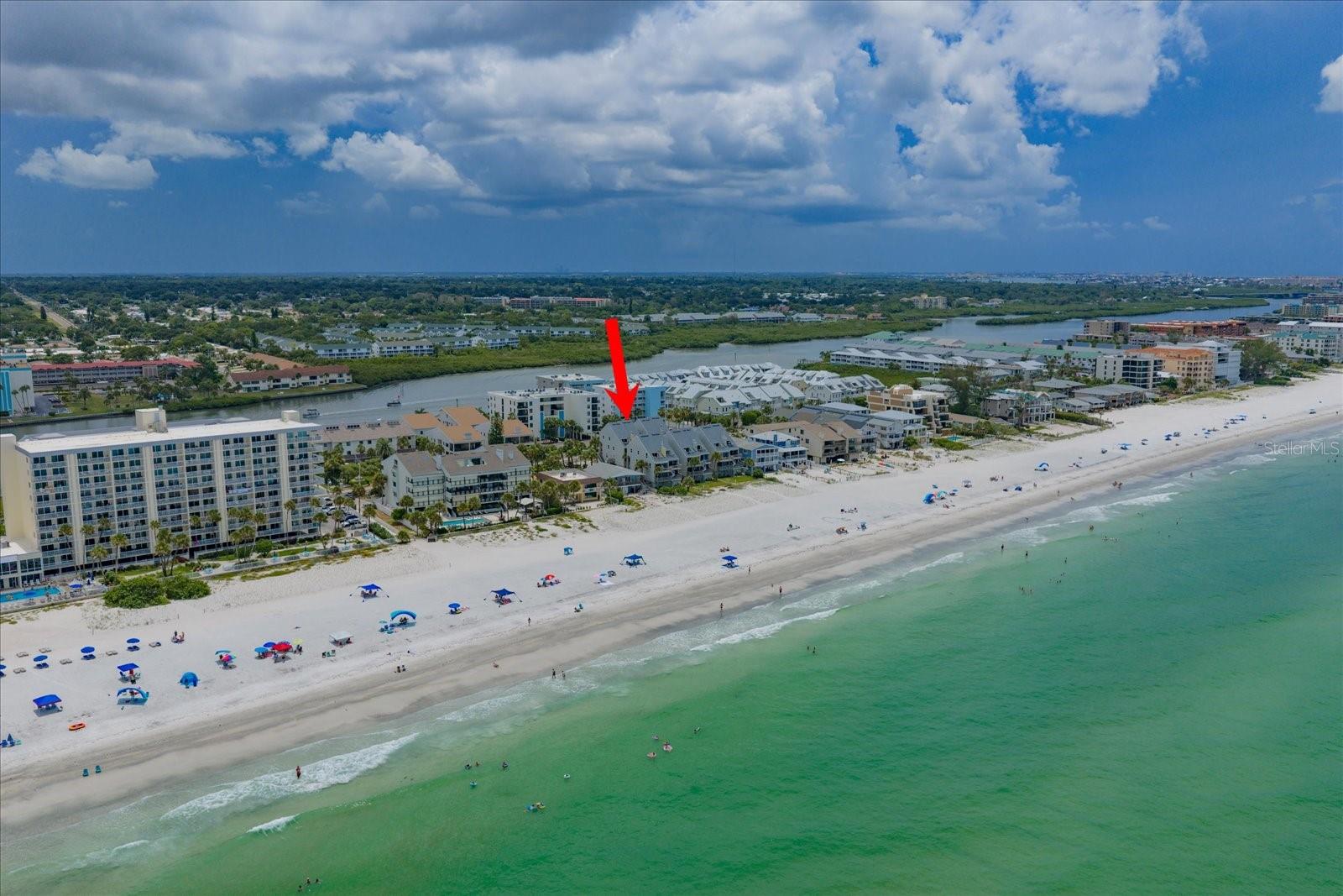 Under contract-accepting backup offers. If you are looking for GULF VIEWS, 2 WEST FACING BALCONIES, BREATHTAKING SUNSETS, DIRECT BEACH ACCESS, A PEACEFUL RETREAT, DESIRABLE INDIAN SHORES LOCATION, UPDATED, TURNKEY, SPACIOUS and COMFORTABLE INTERIOR, COVERED PARKING (for more than one car), STORAGE, PET FRIENDLY, INSIDE LAUNDRY and an option for SHORT TERM RENTALS…then you have FOUND IT! Perfect as a full time residence, 2nd home, or investment opportunity, this is YOUR chance to check the boxes and own a slice of beach paradise in one of Florida’s most desirable locations. Pelicans Pointe is a BEACHFRONT COMPLEX of 15 residences offering direct access to miles of pristine sand and sparkling GULF WATERS. Located away from nearby public beach access points, this stretch of Indian Shores enjoys a quieter, more relaxed atmosphere, perfect for morning walks, sunset strolls, and simply unwinding by the water. Unit #2A is an elevated, 2 bed / 2.5 bath, townhouse style condo offering the perfect blend of coastal charm and homelike feel. OPEN CONCEPT KITCHEN, LIVING and DINING SPACE flows effortlessly to a COMFORTABLE OVERSIZED BALCONY with GULF VIEW. Upstairs you will find the PRIMARY BEDROOM SUITE WITH GULF VIEW and PRIVATE BALCONY, walk-in closet and ensuite bathroom, along with the guest bedroom with its own private bathroom. Be sure to review the 3D walkthrough tour and floor plan to fully experience the great layout. Truly MOVE-IN READY, and OFFERED TURNKEY, the current owner has THOUGHTFULLY UPDATED and IMPECCABLY MAINTAINED the property during their ownership. Please request the additional FEATURE SHEET for a list of UPGRADES, IMPROVEMENTS and MECHANICAL AGES. WEEKLY RENTALS are permitted, a rare opportunity in a boutique beachfront community. The condo is currently a successful, professionally managed vacation rental with rental history available and future reservations transferable. Pet friendly complex (owners only) allowing 4 legged friends up to 20lbs. Under building tandem parking with OVERSIZED PRIVATE STORAGE for all the beach toys. Plus, within the private storage room there is a second lockable closet…genius! While Indian Shores exudes a laid-back atmosphere, you're within minutes of a variety of things to do, casual and fine dining, shopping, activities, sporting events, culture and entertainment. BRING YOUR FLIP FLOPS, THE BEACH IS CALLING!