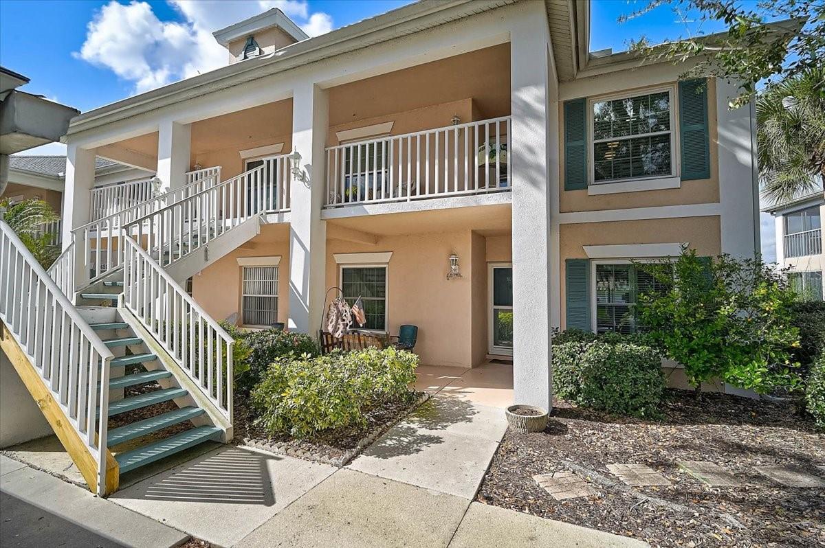 Welcome to this beautiful second-floor end-unit condominium offering tranquil lake views and vaulted ceilings that enhance the open, airy layout. Enjoy maintenance-free living in this 2BR/2BA residence featuring a desirable split floor plan. Recent updates include a new roof (2025) and appliances less than three years old. Impact windows and doors were installed in 2019, offering added durability and peace of mind. A wonderful opportunity to enjoy comfort, convenience, and scenic surroundings. Each building features a designated garage with 1 assigned parking space per unit. Fairway Trace is located within the Peridia Golf & Country Club community, offering a wide range of recreational and social amenities. Community features include an 18-hole executive golf course, tennis and pickleball courts, clubhouse activities, live entertainment, water aerobics, Mahjong, and various organized clubs. The community hosts member-only events throughout the year and provides an active lifestyle with numerous opportunities for social engagement. Fees include: $4,000 One-time Capital Reserve, $600 Annual food/beverage minimum, $938 Quarterly Master Association fee, and $1,465 Quarterly fee to Gulf Coast Property Management. Schedule your showing today!