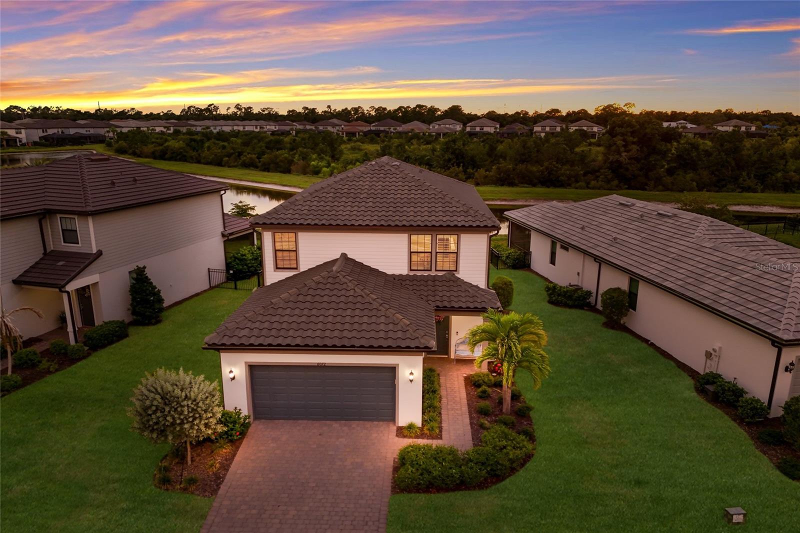 WELCOME to this BEAUTIFULLY maintained Morris model by Pulte offering 4 bedrooms, 3 bathrooms, and a 2 car garage in the highly sought after GATED community of Sapphire Point at Lakewood Ranch. This MOVE-IN READY home offers a thoughtful layout that blends comfortable everyday living with inviting spaces for entertaining. As you step inside, you’re welcomed by a spacious kitchen and living room combination. The kitchen showcases beautiful cabinetry, a STYLISH tile backsplash, stainless steel appliances, a center ISLAND with seating, and ample counter space, while the adjacent dining area features sliding glass doors leading to the SCREENED lanai for seamless indoor-outdoor living. The spacious living room offers the perfect place to relax and unwind after a long day. The first floor also includes a bedroom and a full bathroom with a tiled glass walk-in shower, making it ideal for guests or a home office. Upstairs, you’ll find a versatile LOFT perfect for a media room, game room, or playroom, along with an OVERSIZED owner’s suite featuring peaceful pond views and breathtaking Florida sunsets. The ENSUITE bathroom offers dual vanities, a tiled glass walk-in shower with a BUILT-IN BENCH, and a SPACIOUS walk-in closet. Two additional bedrooms share a full bathroom with an extended vanity and a tub/shower combination. Step outside to the fully screened lanai where you can relax while enjoying tranquil pond and sunset views, while the spacious backyard offers plenty of room to add a custom pool or simply enjoy outdoor entertaining with family and friends. Additional highlights include beautiful landscaping, PLANTATION SHUTTERS throughout, and true move-in ready condition. Sapphire Point offers exceptional resort style amenities, including a clubhouse, community pool, state-of-the-art fitness center, basketball court, playground, dog park, and miles of walking and biking trails, creating a community where there’s truly something for everyone to enjoy. Lakewood Ranch is known for their A+ rated school system and is perfectly located just a short ride to downtown Sarasota, St. Pete, world class shopping, fine dining and the FAMOUS Gulf beaches! Don't wait to make this your HOME and begin your FLORIDA Lifestyle!