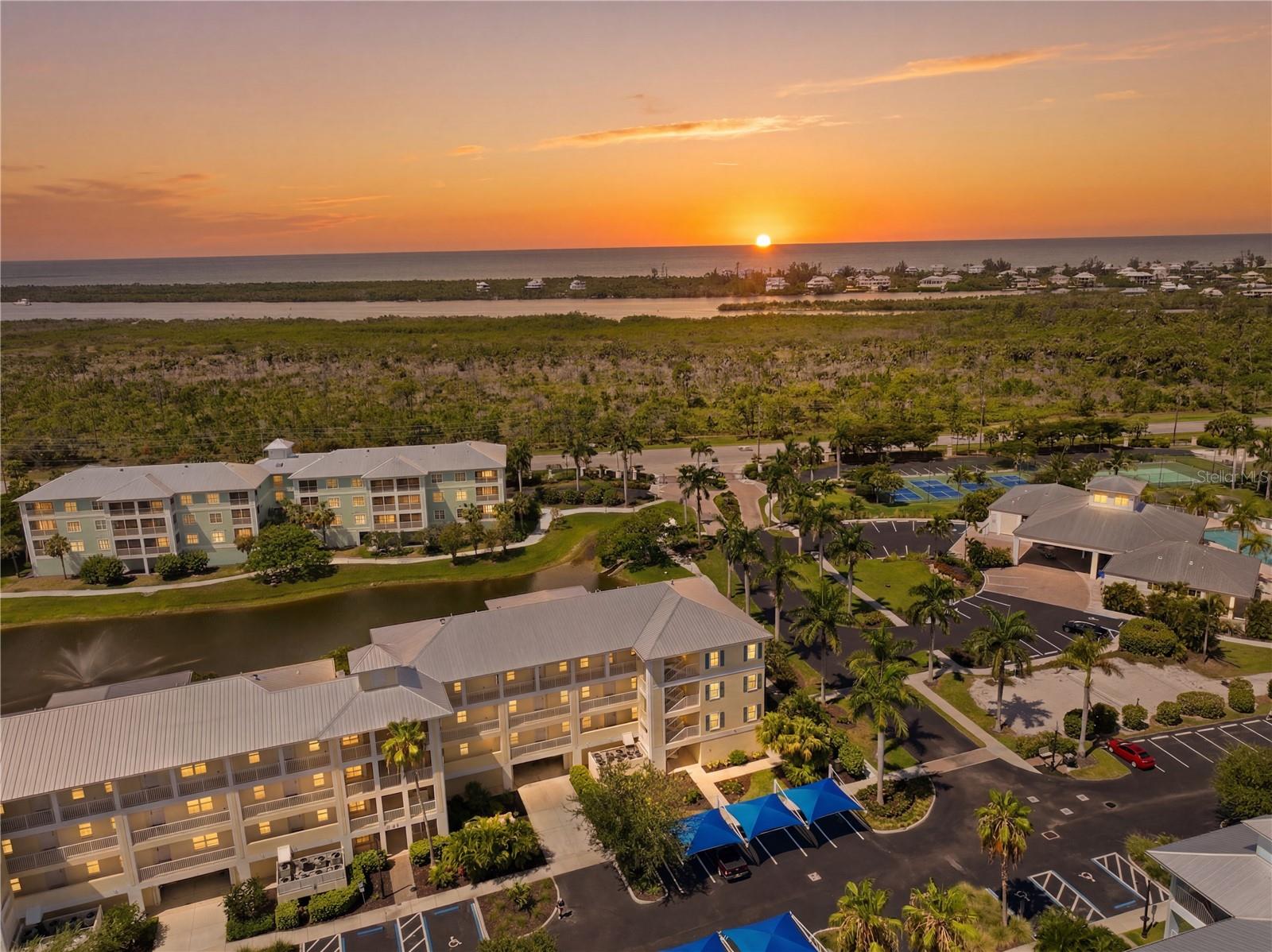 Virtually Staged. Welcome to 8411 Placida Road #407, where coastal comfort meets the relaxed elegance of life at Cape Haze Resort. Perfectly positioned within one of the community's most desirable buildings, this beautifully maintained condominium enjoys an ideal location for taking in the area's breathtaking Florida sunsets, with western skies providing a picturesque backdrop as the day comes to a close.

Inside, the inviting open-concept floor plan creates a bright and comfortable living space that's equally suited for everyday living or seasonal escapes. The spacious screened lanai extends your living area outdoors, offering the perfect place to enjoy morning coffee, unwind after a day on the water, or simply watch the sky transform into brilliant shades of orange, pink, and gold each evening.

Cape Haze Resort is a gated, Key West-inspired community surrounded by hundreds of acres of protected natural preserve, creating a peaceful setting while offering an exceptional collection of resort-style amenities. Residents enjoy a spectacular heated pool and spa, a beautifully appointed clubhouse, fitness center, tennis and pickleball courts, basketball court, putting green, volleyball court, walking paths, and an active social atmosphere that makes every day feel like a vacation.

The location is equally impressive. Just minutes from Boca Grande, Englewood Beach, Don Pedro Island State Park, multiple marinas, world-class fishing, waterfront dining, shopping, and golf, you'll have endless opportunities to experience the very best of Southwest Florida's coastal lifestyle.

Whether you're searching for a full-time residence, seasonal retreat, or investment opportunity, 8411 Placida Road #407 offers the perfect blend of comfort, convenience, and resort-style amenities all from one of the community's premier locations.