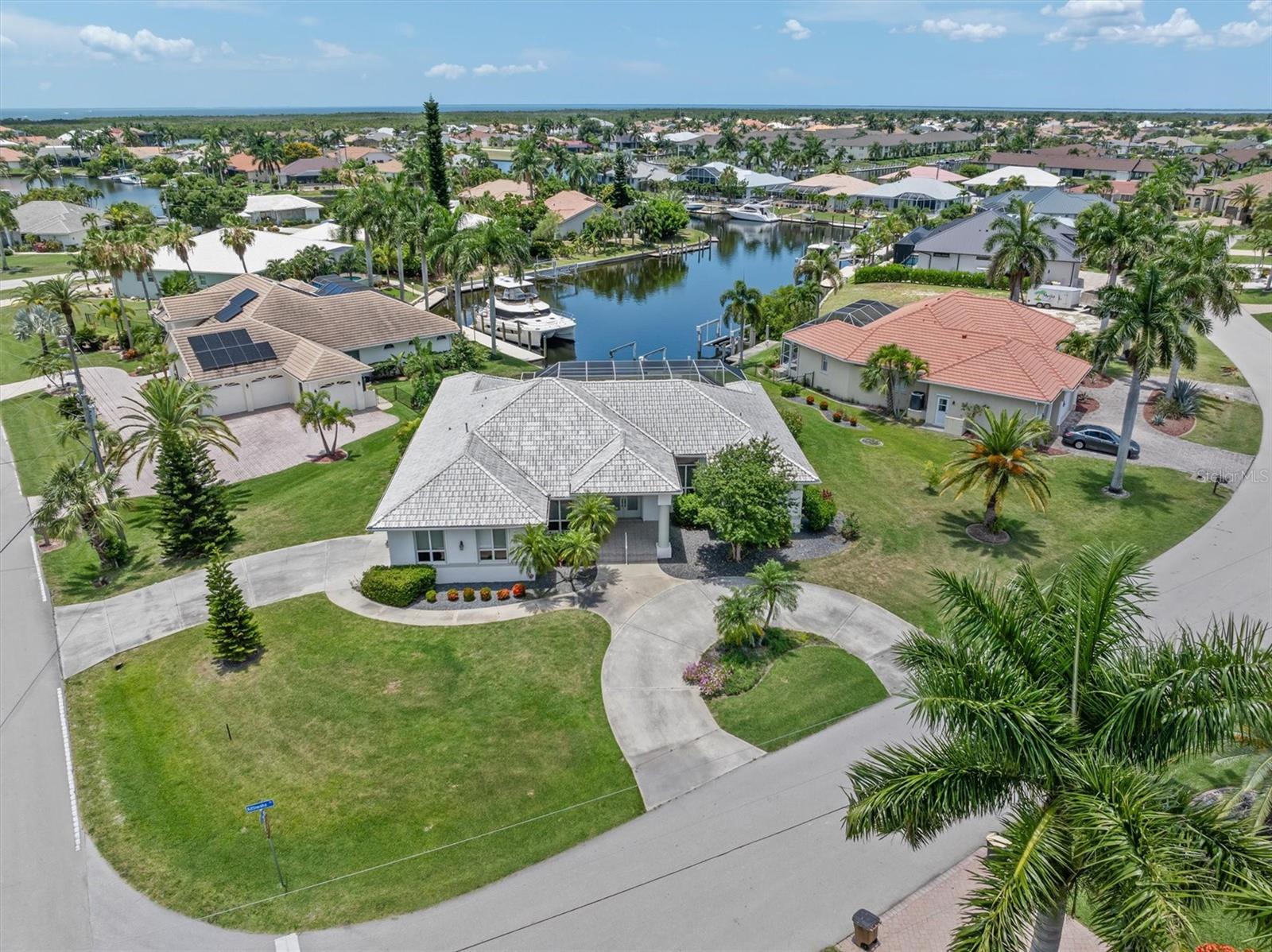 PRIME LOCATION MEETS UNMATCHED POTENTIAL IN THIS ONE-OWNER CUSTOM BUILT PROPERTY.  Bring your design ideas to this quality construction Towles Boca Grande home. This spacious floor plan with 2,434SF features 3 bed, 2 bath, 2-car garage, pool home offers QUICK BOATING ACCESS TO CHARLOTTE HARBOR LEADING TO THE GULF! Located in the desirable “bird section” of Punta Gorda Isles, and situated on a large .40 acre lot, 2 driveways and side entry garage, all come together creating an inviting first impression. 

The front porch entry leads you inside to a large great room area with 14ft high vaulted ceilings. This space has the potential for MAJOR WOW factor with all the natural light and oversized pocket sliding glass doors showcasing beautiful pool and water views. In the kitchen area you will find a large laundry area and 2 spacious closets for pantry and other storage items. Generous primary bedroom has access to the lanai, high ceilings, 2 walk-in closets, and an ensuite bath complete with dual sinks, a soaker tub and walk-in shower. Two additional nicely sized secondary guest bedrooms are separated by a split floor plan giving your family and guests privacy.

Step outside to discover a large under-roof space perfect for entertaining or relaxing. Enjoy amazing sunsets from this Southwest facing lot and enjoy lots of sun on your pool. The home is storm-ready with accordion-style shutters for effortless preparations. The 2024 water heater is heated by a propane tank that also runs the gas fireplace.

This is a value-driven opportunity for buyers looking to create their own coastal retreat in one of Punta Gorda’s most sought-after boating communities—close to downtown dining, shopping, parks, golf and waterfront activities. Bring your vision and make this waterfront home your own slice of paradise.