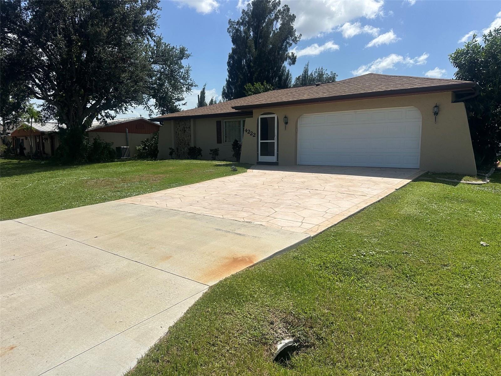 AMAZING VALUE & MOTIVATED SELLER! This 2-bed, 2-bath pool home is the deal of the neighborhood! The owner is fully packed up, ready to relocate, and has priced this home for an immediate sale. Don't let the storage boxes fool you—underneath the moving prep is a sturdy block home bursting with potential. Step through the sliding glass doors to find your own private, in-ground pool oasis with a fully fenced backyard. The interior features a functional split-bedroom layout and an eat-in kitchen with a pass-through window to the patio. Bring your personal touches to make it your own! Excellent location close to beaches, fishing, and waterfront entertainment.