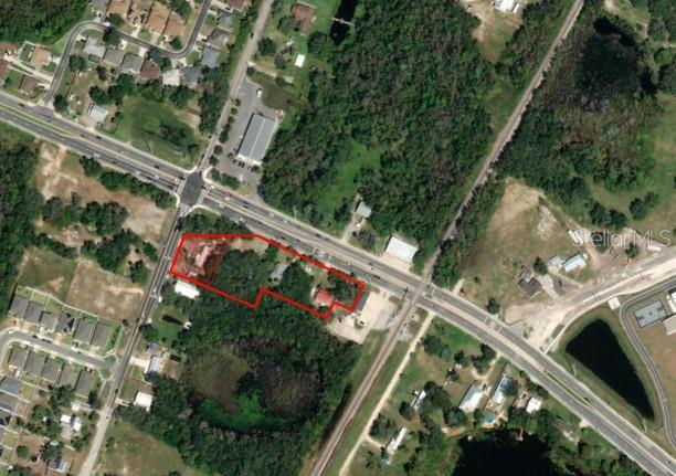 This residential property is part of a 1.9+/- acre assemblage of 6 parcels (marketed along with MLS#R4906453) with frontage on Ronald Reagan Parkway and CR 547. The assemblage has strong commercial potential with over 350 Frontage Feet on Ronald Reagan Parkway. Owners make no representations on the condition of the residential dwellings on the property - the value is in the land.