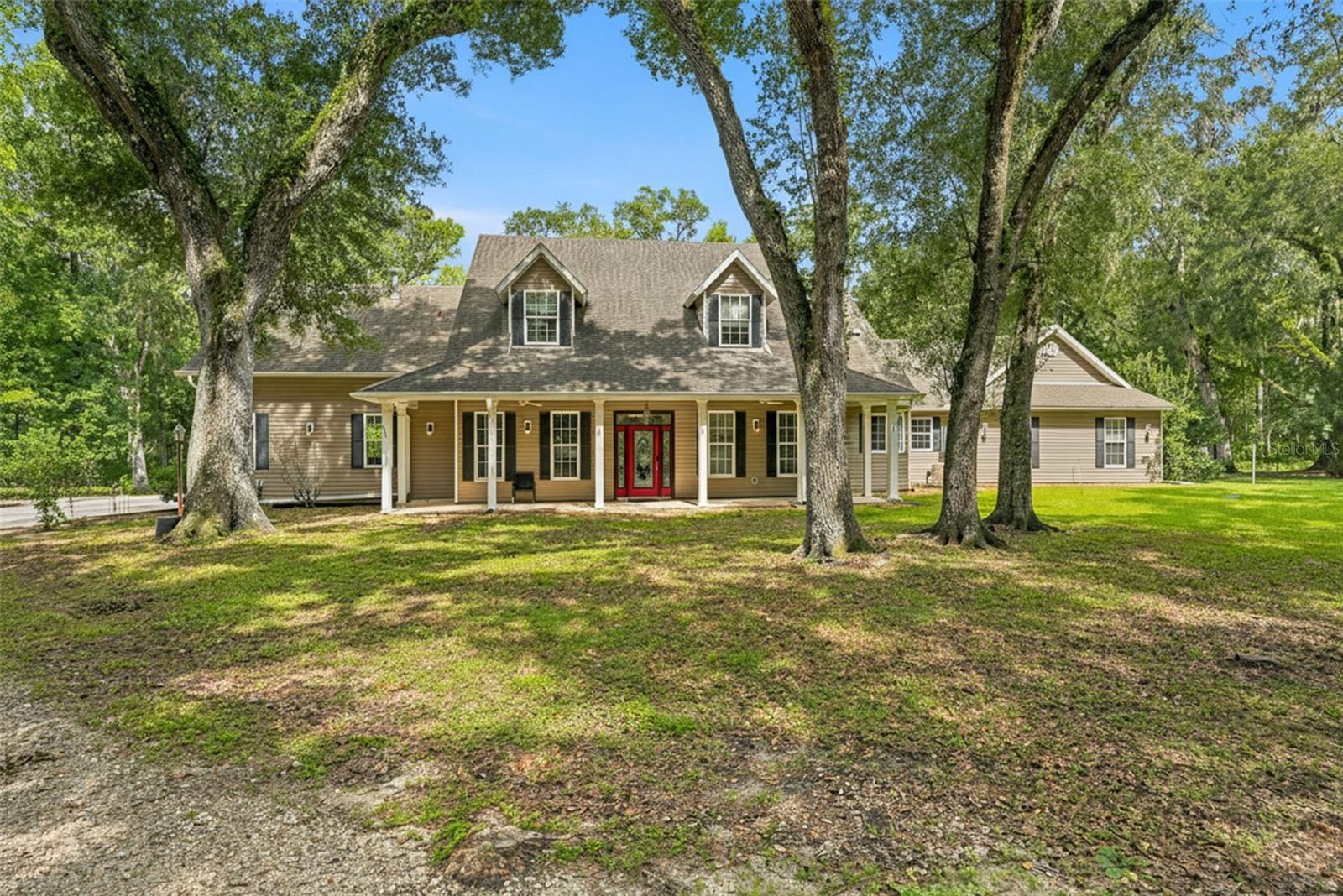 THIS ONE HAS IT All!!!  A rare find with 2 homes + private pool nestled on 5 secluded acres in Beautiful Brooksville!! Great property for multi-generational living!! The main home is impressive and offers 4 bedrooms + 3.5  bathrooms + 6 car detached garage + Spa! The home has gorgeous 2-story ceilings, an open floor plan, large glass windows making this home feel light, bright and spacious!! 
Gorgeous upgraded kitchen and bathrooms!!

The second full home offers 2 bedrooms + 1 full bathroom + full kitchen + 1 car attached garage + pool access!! This rare property offers a total of 5,845 living space and 8,435 total sq footage!!! 6 bedrooms + 4.5  bathrooms + 4-car garage spaces + pool + 5 acres. The two homes are connected through a common area, but can be completely closed off, as well, for privacy!  

The home has lots of updates, these were done in 2020:  Well Pump, wiring & pipes, Water Filtration System, 2 Tankless Water heaters, Spa Heater, fencing in front of home, Water Filtration System, Dishwasher & Refrigerator, fencing in front of home, and added a delivery access driveway for UPS/FedEx. 
2021:  Whole house generator, Grout redone in master shower & 3 other bath(s) & showers, New AC for downstairs, remodeled rec room/bar, added glass patio doors. 
2022: New Flooring in Guest house living room, kitchen & halls, Patio screen redone, New Copper sink & faucets in kitchen.
2023: New AC for upstairs, Septic Filter replaced, New spa pump & filter, Driveway repacked & filled, Decorative boulders placed in drainage ravine. 
2024: New Filter in Well System, Floor in bedroom 2 redone, Cleared 1 acre of underbrush, New vanity in the guest house bathroom. 
2025: New sink faucet in bathroom 2, Complete Interior repainted, including trim, New carpet in office & guest house 2 bedrooms, New Wall Oven/Microwave Combo, New drainage stone put down around the outside perimeter (20 yards total), Removed all tree & branch debris around yard & cleared, Cut down dead or damaged trees endangering the garage & front gate area,New Spa timer & New washer. 
Close to everything!! Shoppes, restaurants, hospitals, schools...everything!! Less than 10 minutes to kayaking, paddle-boarding, and swimming with the manatees in the clear Weeki Wachee River or enjoying a day at Buccaneer Bay Water Park!! 15 minutes to the sunsets at Pine Island, boating and fishing!! Less than 10 minutes to the Suncoast Parkway for quick and easy access to Tampa International Airport and for all the fun that Tampa Bay has to offer!! 1 hour + to TOP US BEACHES!! 1.5 hours to Disney World and Universal Studios and all the theme parks!!