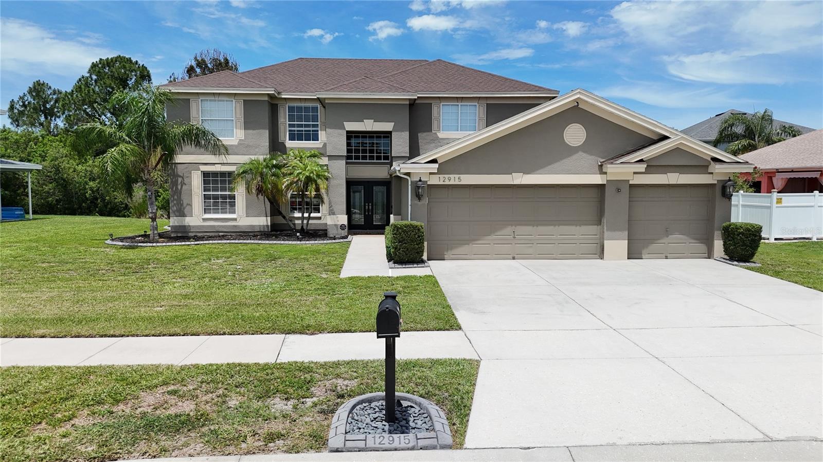 Welcome to luxury living in one of Riverview's most desirable golf course communities. Perfectly positioned with stunning fairway views, this exceptional 5-bedroom, 3-bathroom single-family home offers the ideal combination of space, comfort, and resort-style amenities. From the moment you enter, you'll appreciate the thoughtfully designed floor plan featuring both a formal living room and spacious family room, creating plenty of space for entertaining and everyday living. The elegant formal dining room is perfect for hosting gatherings, while the chef-inspired kitchen boasts granite countertops, abundant cabinetry, a dedicated coffee bar, and seamless flow into the main living areas. Designed for both relaxation and entertainment, this home features a private in-home movie theater, creating the ultimate cinematic experience without ever leaving home. The spacious primary suite and generously sized secondary bedrooms provide comfort and flexibility for families, guests, or a home office setup. Step outside to your own backyard retreat overlooking the golf course. The expansive outdoor living space includes a fully equipped outdoor kitchen and grill, making it easy to enjoy Florida's year-round sunshine. A beautiful water fountain adds a touch of tranquility, creating the perfect setting for outdoor dining, entertaining, or simply unwinding after a long day. Additional highlights include a desirable 3-car garage, mature landscaping, abundant natural light, and ample storage throughout. Conveniently located near top-rated schools, shopping, dining, entertainment, major highways, and everything Riverview has, this golf course home presents an incredible opportunity to enjoy the Florida lifestyle you've been dreaming of. Experience luxury, space, and breathtaking golf course views—all in the heart of Riverview.