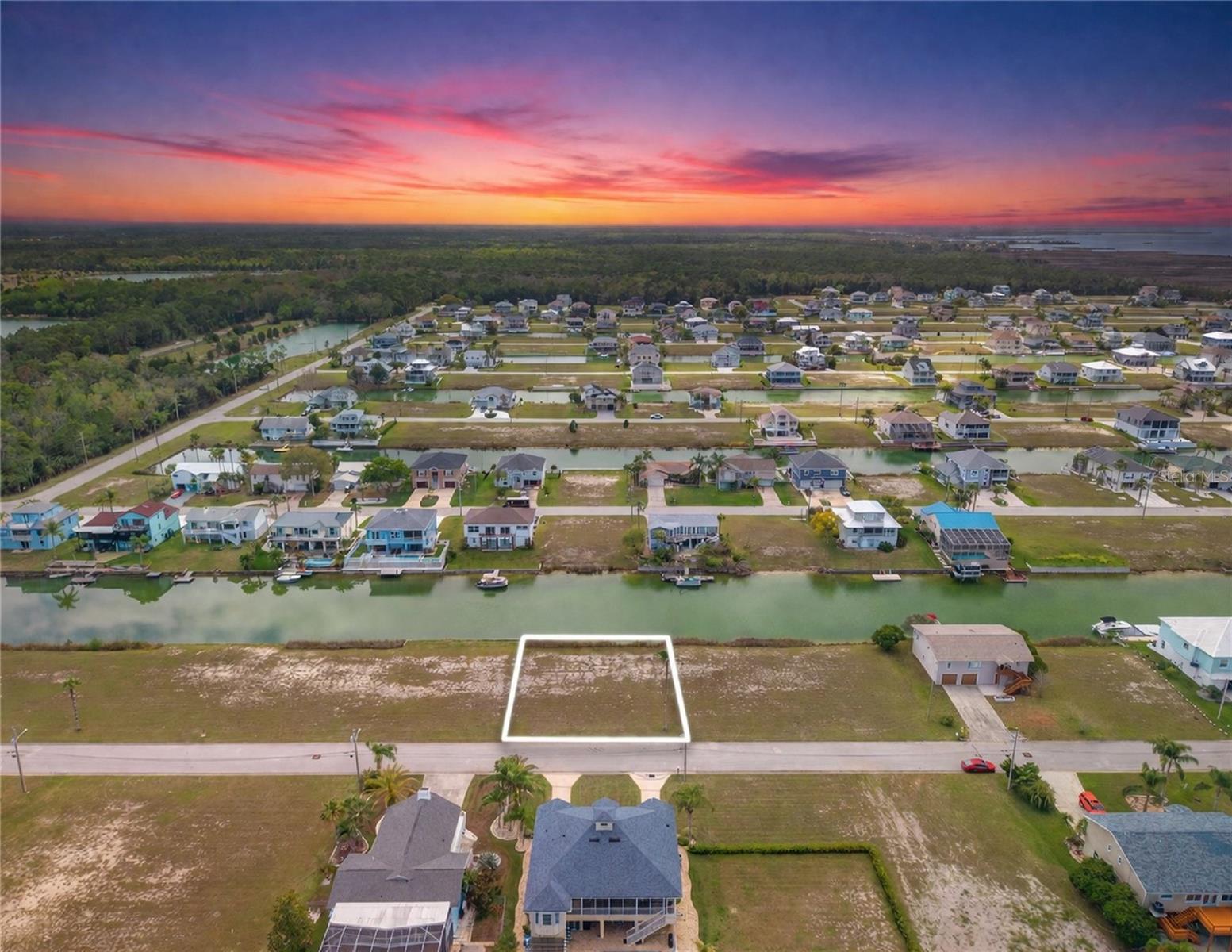 Waterfront Gulf-access opportunity to build your custom coastal retreat on this 75x100 canal-front home-site at 4018 Amberjack Dr in Hernando Beach South, where your boat can be docked right in your backyard with direct access to the Gulf of Mexico in just minutes. Designed for a refined coastal lifestyle, this prime lot allows for a private dock and lift, creating a seamless lifestyle centered around boating, fishing, and waterfront relaxation. Enjoy the benefits of NO CDD and a low HOA of just $330/year until construction, which includes grass maintenance to keep holding costs minimal. Set within a golf cart-friendly community, you’re moments from Weeki Wachee Springs State Park for crystal-clear kayaking and paddle boarding, and a short drive to Rainbow Springs State Park for tubing, swimming, and scenic nature trails. Surrounded by top-rated golf courses, marinas, waterfront dining, and everyday conveniences, this location delivers both lifestyle and accessibility. Deed-restricted with no short-term rentals, preserving long-term value and neighborhood quality. Gulf-access waterfront home sites of this caliber are limited and highly sought after secure your opportunity to build before it’s gone. ~( Bring your offers, seller will review all serious proposals.)~