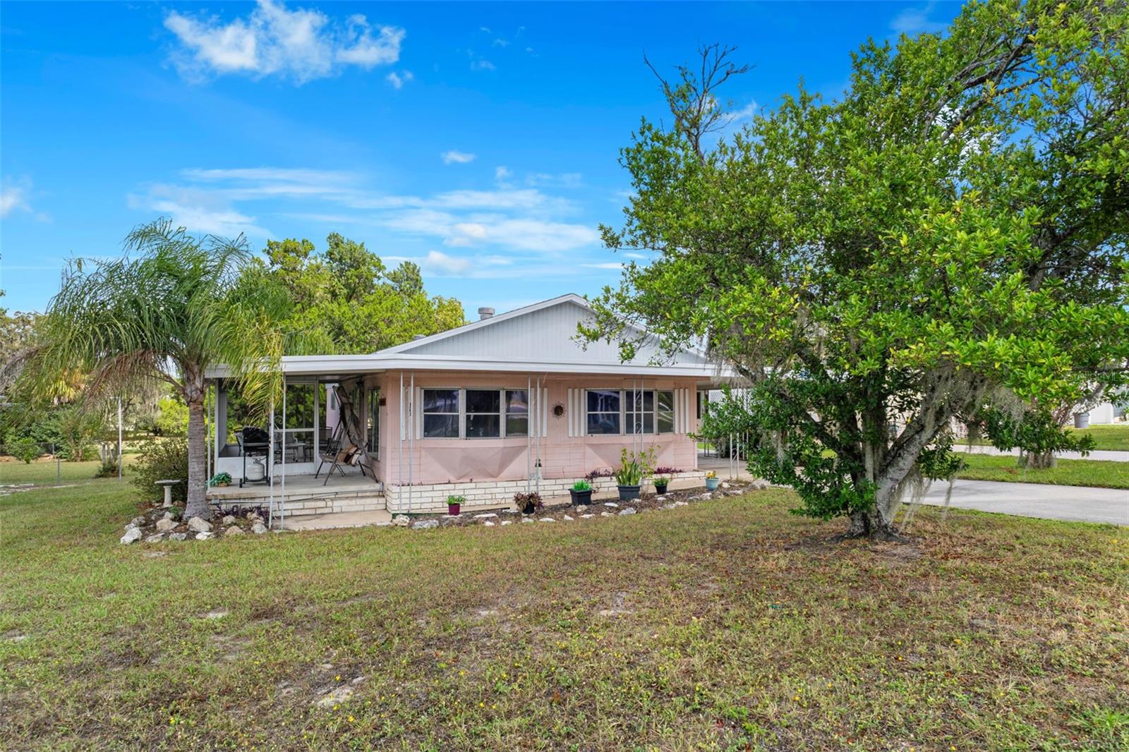 Move-in ready and fully furnished, this charming home offers golf course views right from your backyard. The spacious layout features two comfortable bedrooms, two full baths, and an inviting living area perfect for entertaining or simply unwinding. Whether you're looking for a seasonal escape or full-time residence, this home has it all—just bring your suitcase! Located in the desirable and vibrant High Point 55+ community, enjoy a relaxed Florida lifestyle with access to top-notch amenities including golf, pools, clubhouse activities, and more. Close to shopping, restaurants, entertainment, and medical facilities. Low HOA fees and you OWN YOUR OWN LAND.
