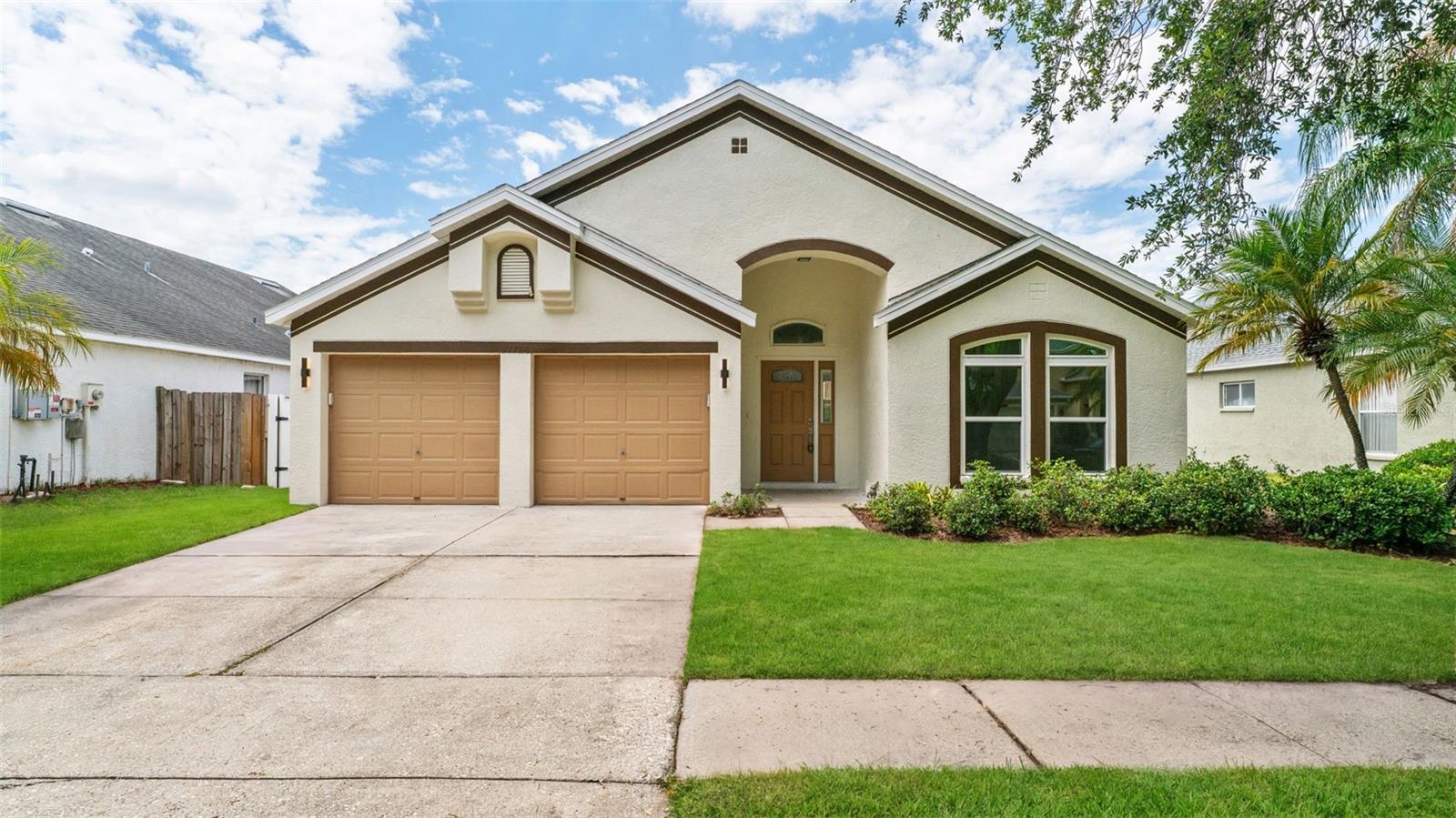 Welcome to this beautifully upgraded home in the heart of Carrollwood! This property has been thoughtfully renovated with high-end finishes and modern touches throughout, offering both style and functionality.

Step inside to find newly installed flooring throughout. Enjoy a fully updated kitchen and dining area with an open floor design not often found in similar homes, featuring top-grade exotic granite countertops, an elegant color palette, and a stunning waterfall island perfect for entertaining. The kitchen offers plenty of new cabinetry, along with a separate bar/coffee/small appliance area with additional storage. It is equipped with new appliances, including a wine/beverage cooler, making it a true centerpiece of the home.

The bathrooms feature matching exotic granite, top-grade tile on both the walls and floors, and new vanities. There is also an additional flex room, privately located, ideal for a home office.

Enjoy peace of mind with a brand-new roof and 29 high-end solar panels installed in 2026. The home includes numerous electrical upgrades, all brought up to current code standards. The solar panels are completely paid off. The property has also been freshly painted inside and out with premium Sherwin-Williams paint, giving it a clean, modern feel.

An attached two (2) car garage adds everyday convenience.

Step outside to your private backyard oasis, featuring a fully fenced yard and a screened-in swimming pool with pavers surrounding it. Fresh St. Augustine sod enhances the outdoor space, making it ideal for relaxing or hosting guests year-round. The fully paid-off solar panels (valued at $50,000) offering energy efficiency and long-term savings.

This move-in-ready home combines luxury upgrades, major system improvements, and exceptional outdoor living—all in one desirable location.