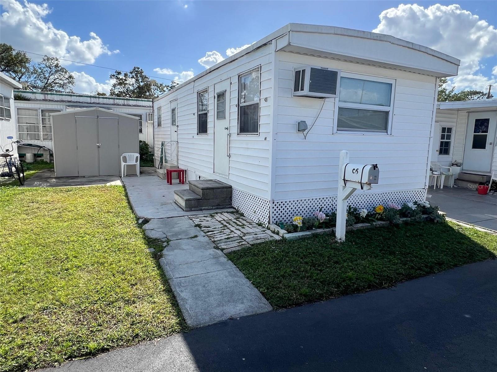 GREAT PRICE! Looking to live in a quaint 55-plus community? Midway AM/CAN is a neighborhood that offers a variety of amenities designed to enhance everyday living. A central highlight is the community clubhouse, where residents gather to socialize, attend events, and participate in group activities.  Along with the clubhouse there are well-maintained shuffleboard courts, ideal for friendly games that bring neighbors together. Additionally, the community provides a pay-by-use laundry facility equipped with washers and dryers, complemented by an outdoor drying yard.  This peaceful enclave featuring this 1 bedroom, 1 bathroom home,  is close to beautiful beaches, enchanting shops, and a wide selection of restaurants, making it easy to enjoy both relaxation and entertainment. With a maintenance fee of just $192.00 per month, residents benefit from essential services, including water, sewer, garbage collection, and lawn care, ensuring a well-kept environment. 
INTERIOR
This adorable, fully furnished home offers a cozy and inviting atmosphere, perfect for a move-in-ready experience.  The kitchen comes equipped with essential appliances, including a fridge, oven, stove and microwave, making meal preparation convenient and enjoyable. The eat-in area in the kitchen invites you to enjoy meals in a relaxed setting.   The living room features a comfortable sleeper sofa, ideal for relaxing or accommodating guests, along with ceiling fans to keep the space airy. A wall unit provides both air conditioning and heat, ensuring comfort year-round.  The home’s interior has been carefully maintained, with neat, clean spaces and durable laminate flooring throughout most of the home, except for the bathroom, which features easy-to-clean vinyl flooring. The bathroom itself is thoughtfully designed with a walk-in shower for added accessibility and comfort. The aluminum windows have been upgraded from the original, contributing to energy efficiency while retaining the home’s timeless charm.    Storage abounds , with plenty of spaces ready to personalize, offering the flexibility to make it truly your own. 
EXTERIOR:
This property includes a convenient parking space for a single vehicle, in addition to a roof over that was replaced in 2019 for added durability and protection.  A handy shed offers extra storage for tools, seasonal items, or hobby equipment. Priced at an affordable $40,000, this property also comes with a share, making it an attractive option for those looking for a low-maintenance and affordable living space with practical amenities.  This community offers a charming, low-maintenance lifestyle in a prime location for those looking to enjoy their retirement years near the coast.  Make a call today to schedule your private showing of this darling home!